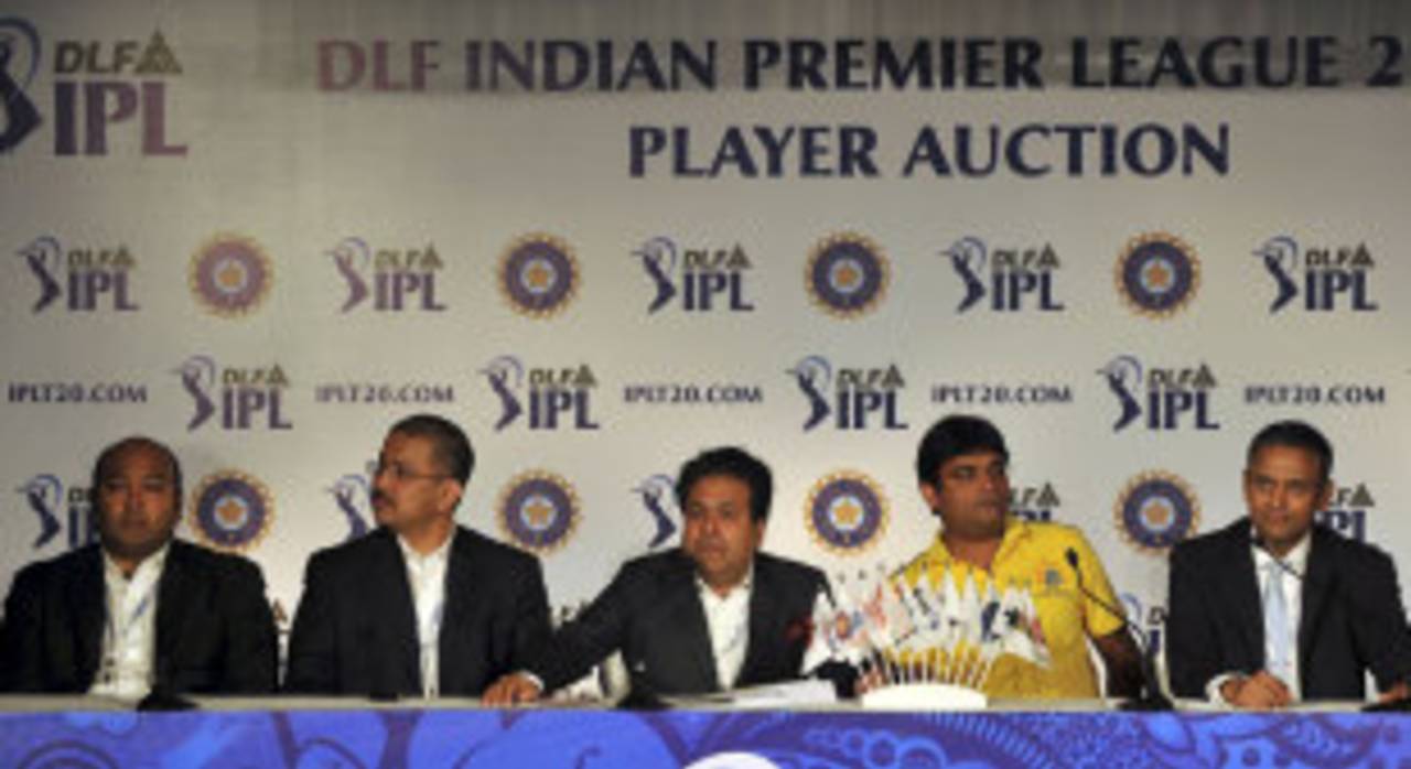 Gurunath Meiyappan, wearing a yellow CSK shirt, with other team owners at a press conference&nbsp;&nbsp;&bull;&nbsp;&nbsp;AFP