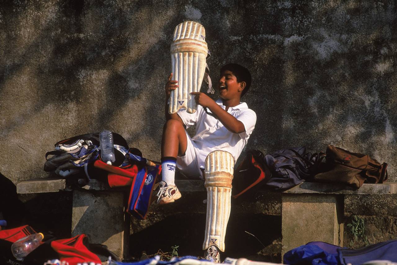 A young cricketer pads up, February 1, 2001