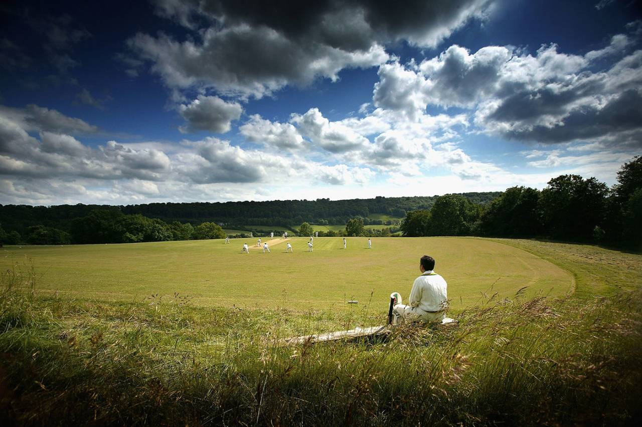 A cricketer waits for his turn to bat at Sheepscombe Cricket Club, Sheepscombe, June 14, 2005
