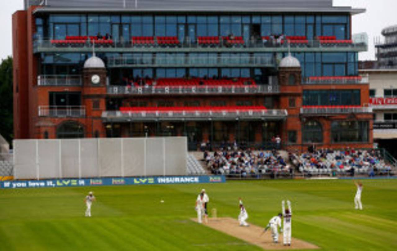 The new pavilion provides the backdrop at Old Trafford, Lancashire v Northamptonshire, County Championship, Division Two, Old Trafford, 1st day, June 20, 2013