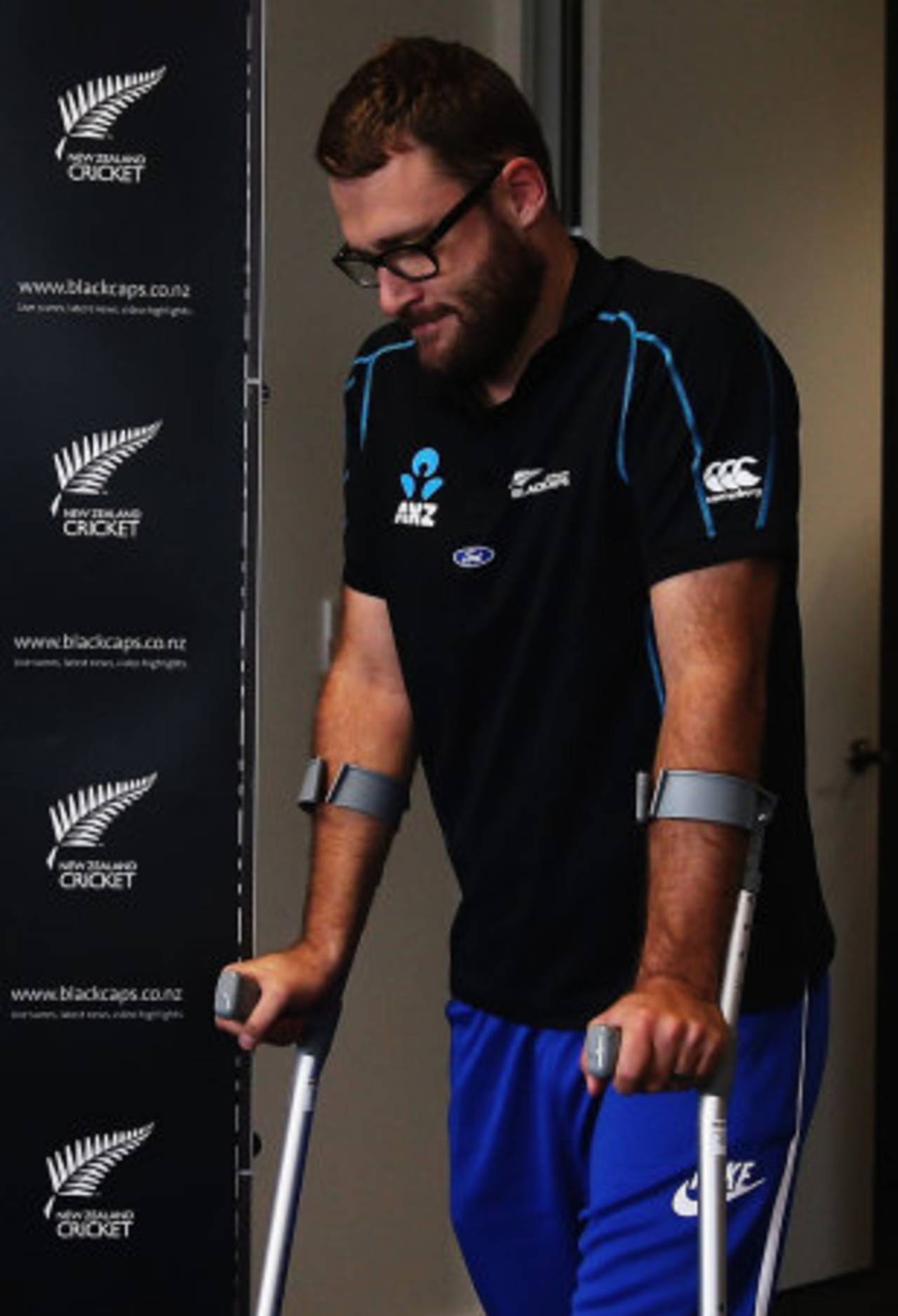 Daniel Vettori arrives on crutches for a press conference, Auckland, July 5, 2013