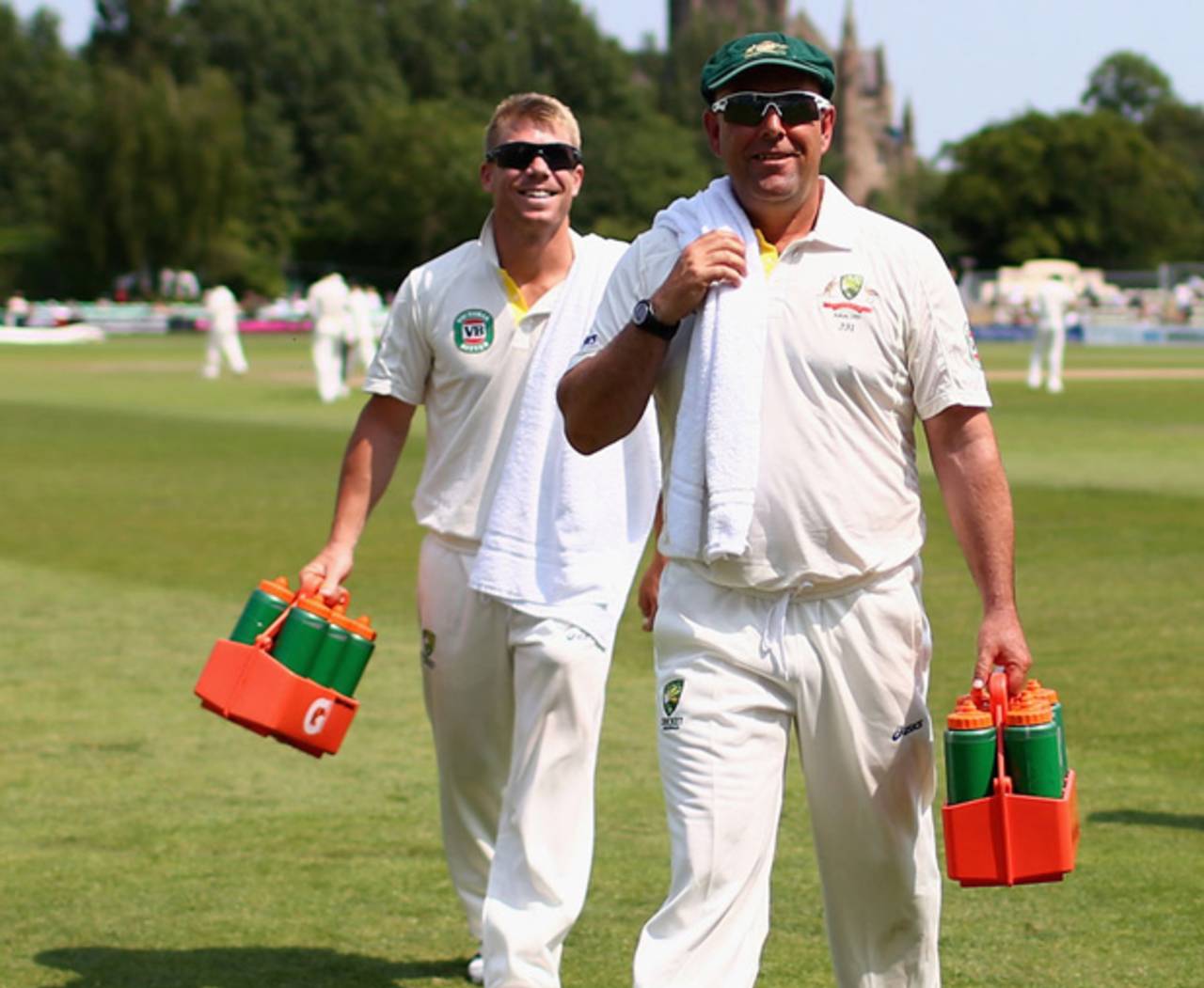 Darren Lehmann and David Warner walk off after carrying drinks, Worcestershire v Australians, 4th day, July 5, 2013