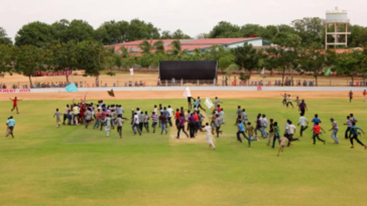 The crowd invades the field at the end of the Rural District Tournament, Anantapur, Andhra Pradesh, July 2013
