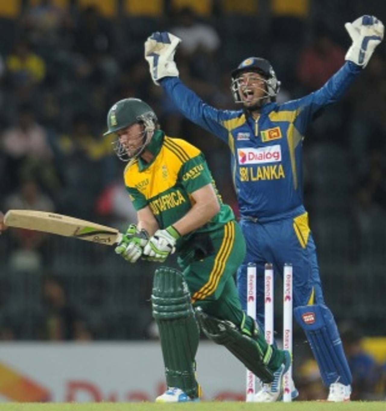 Kumar Sangakkara rejoices after AB de Villiers is bowled, Sri Lanka v South Africa, 1st ODI, Colombo, July 20, 2013