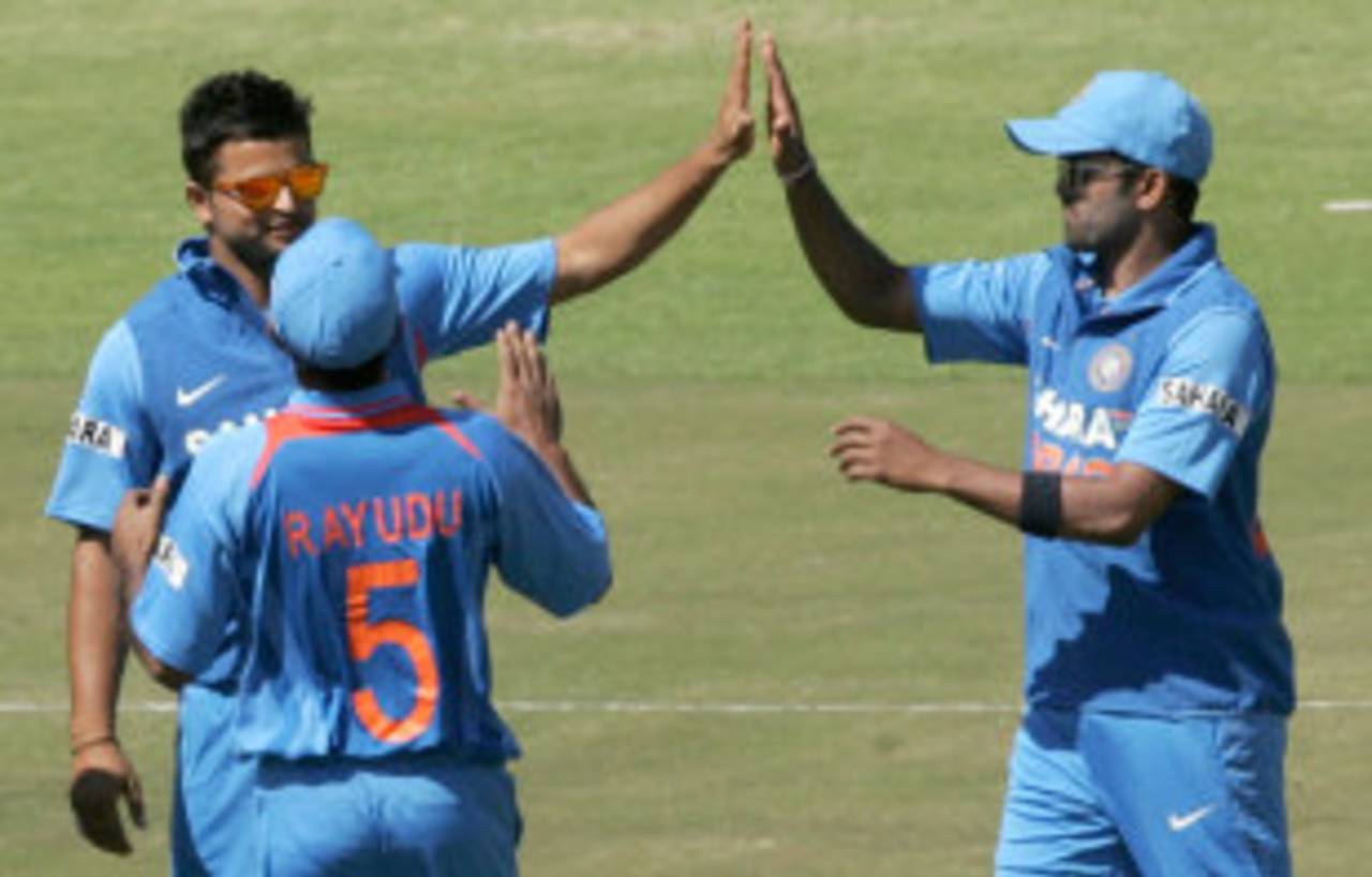 Suresh Raina and team-mates celebrate the wicket of Sean Williams, Zimbabwe v India, 1st ODI, Harare, July 24, 2013