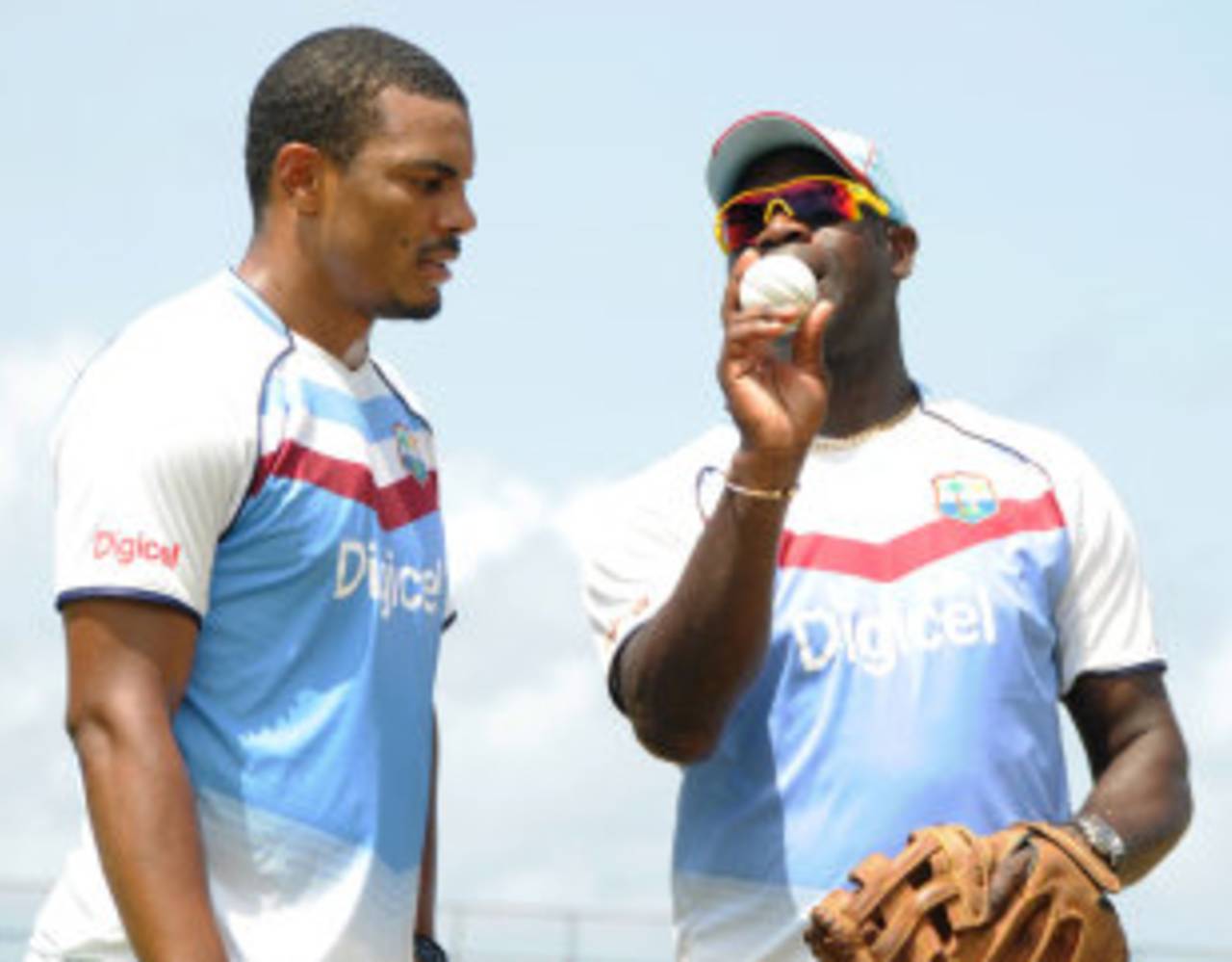West Indies coach Ottis Gibson offers tips to pacer Shannon Gabriel at a practice session, St Vincent, July 25, 2013