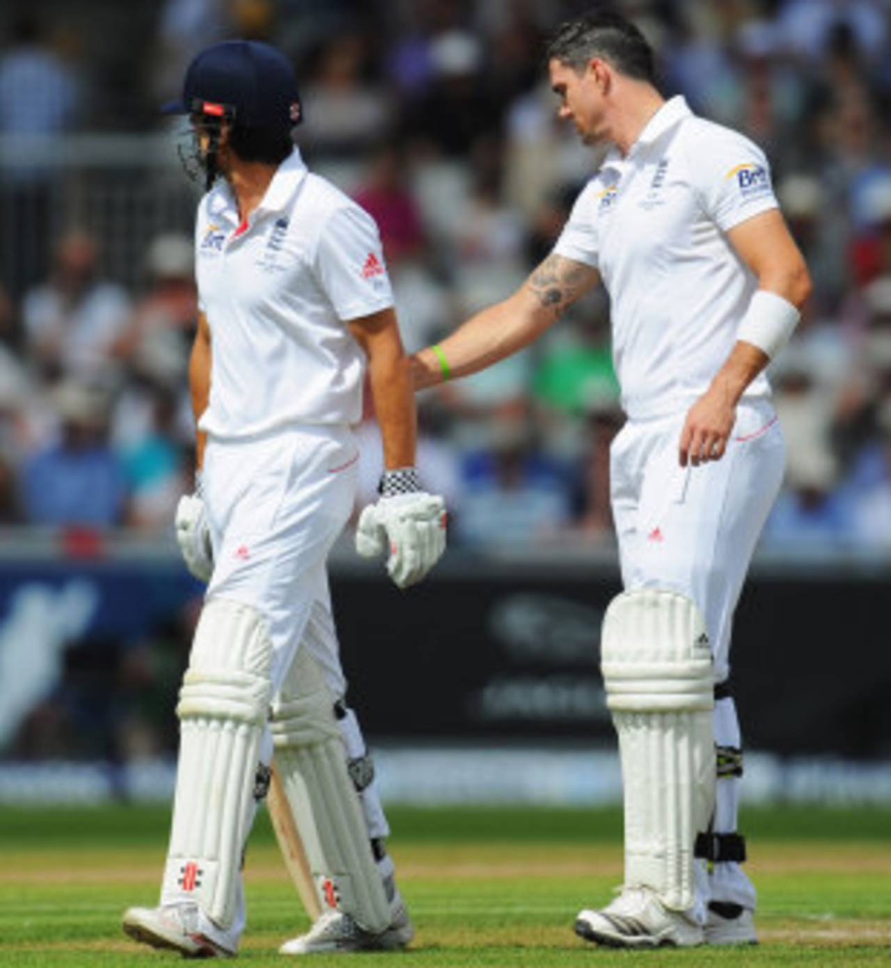 Kevin Pietersen consoles Alastair Cook after the latter was dismissed by Mitchell Starc, England v Australia, 3rd Investec Test, Old Trafford, 3rd day, August 3, 2013