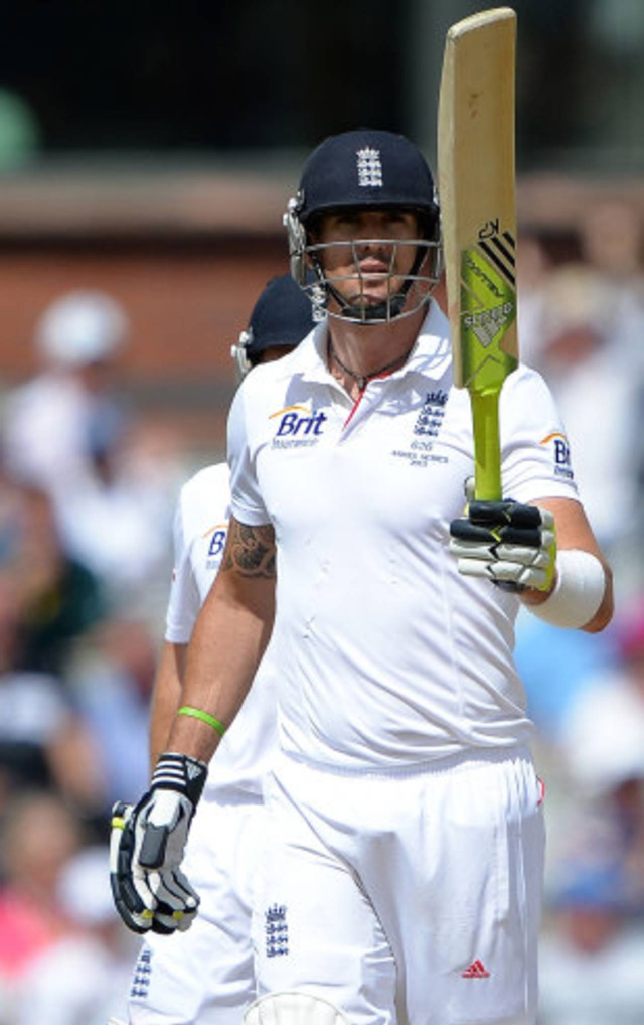 Kevin Pietersen raises his bat after completing a half-century, England v Australia, 3rd Investec Test, Old Trafford, 3rd day, August 3, 2013