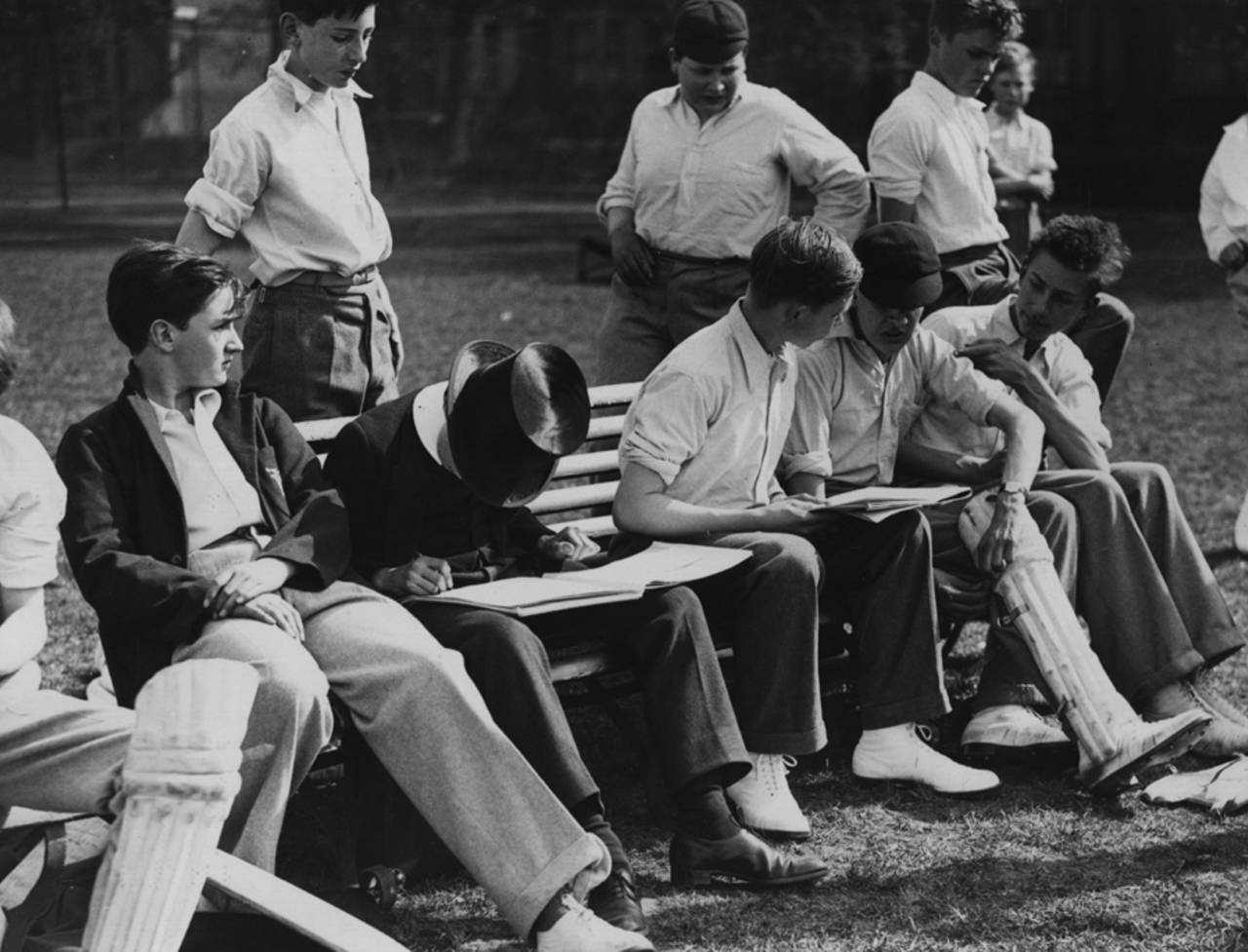 Young cricketers at a Westminster school match keep score, May 16, 1938