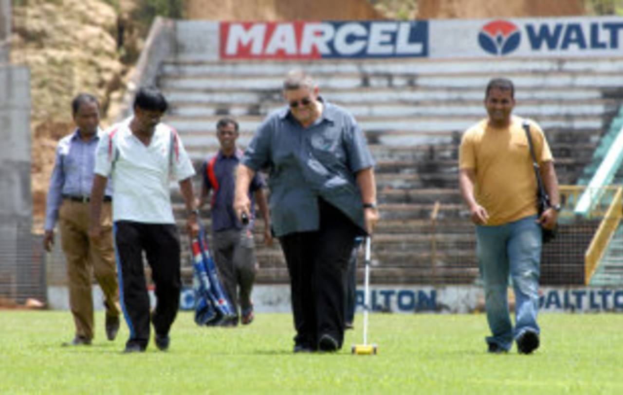 The ICC pitches consultant, Andy Atkinson supervises the track at the Sylhet Stadium, Sylhet, August 18, 2013