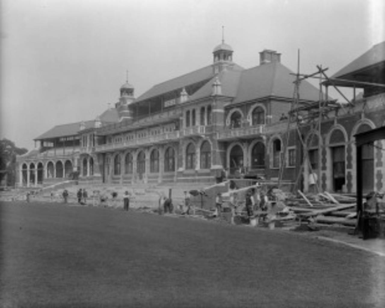 Workmen put the final touches to the new pavilion at The Oval, London, circa 1897