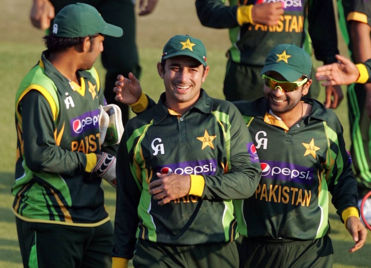 Saeed Ajmal celebrates the win with team-mates, Zimbabwe v Pakistan, 2nd ODI, Harare, August 29, 2013