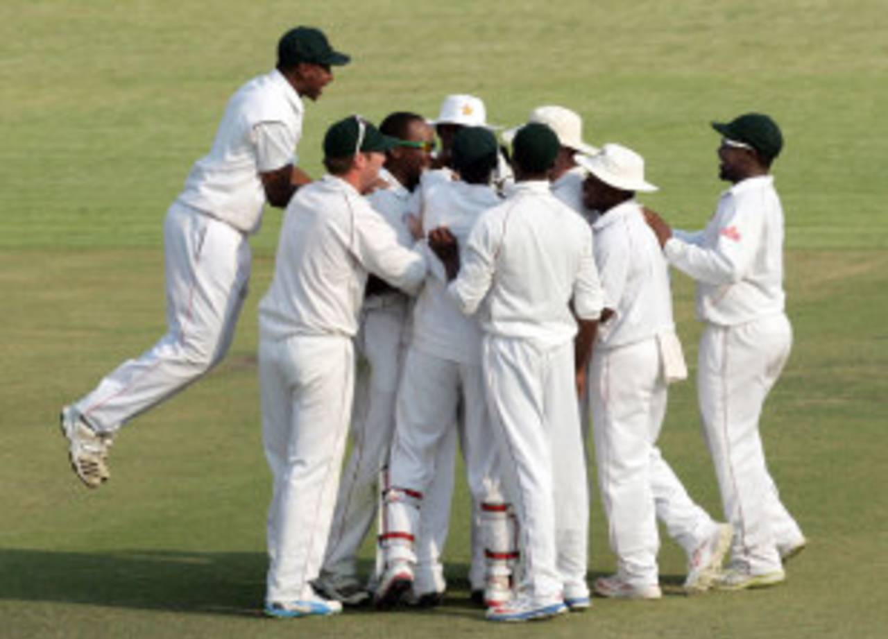 The Zimbabwe players celebrate a wicket, Zimbabwe v Pakistan, 2nd Test, Harare, 4th day, September 13, 2013