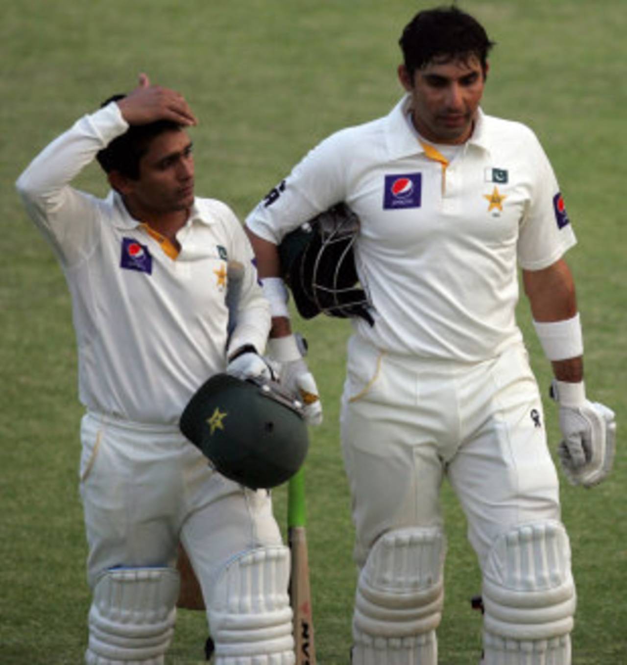 Misbah-ul-Haq and Adnan Akmal walk off the pitch at the end of the day, Zimbabwe v Pakistan, 2nd Test, Harare, 4th day, September 13, 2013