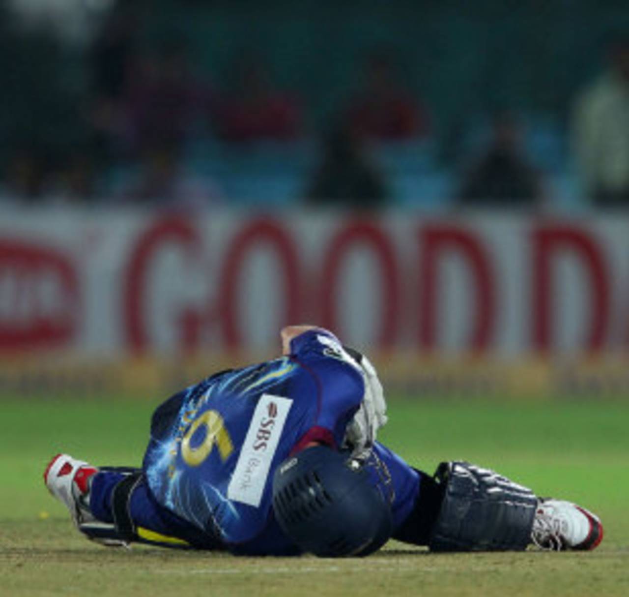 Ian Butler is on the ground after being struck by a full toss, Lions v Otago, Group A, Champions League 2013, Jaipur, September 29, 2013
