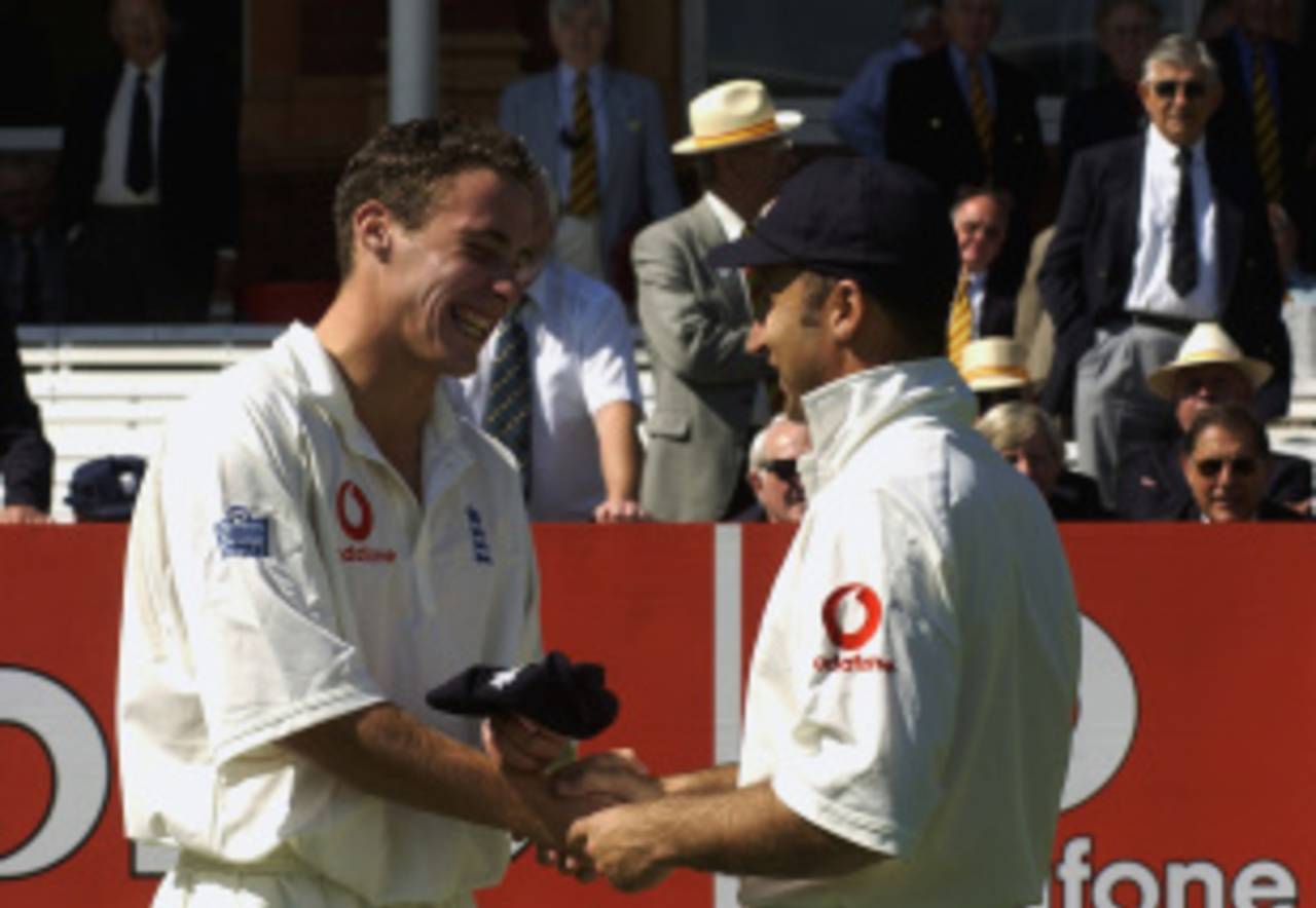Simon Jones grins from ear to ear on getting his Test cap from his captain Nasser Hussain, England v India, 1st Test, Lord's, 1st day, July 25, 2002