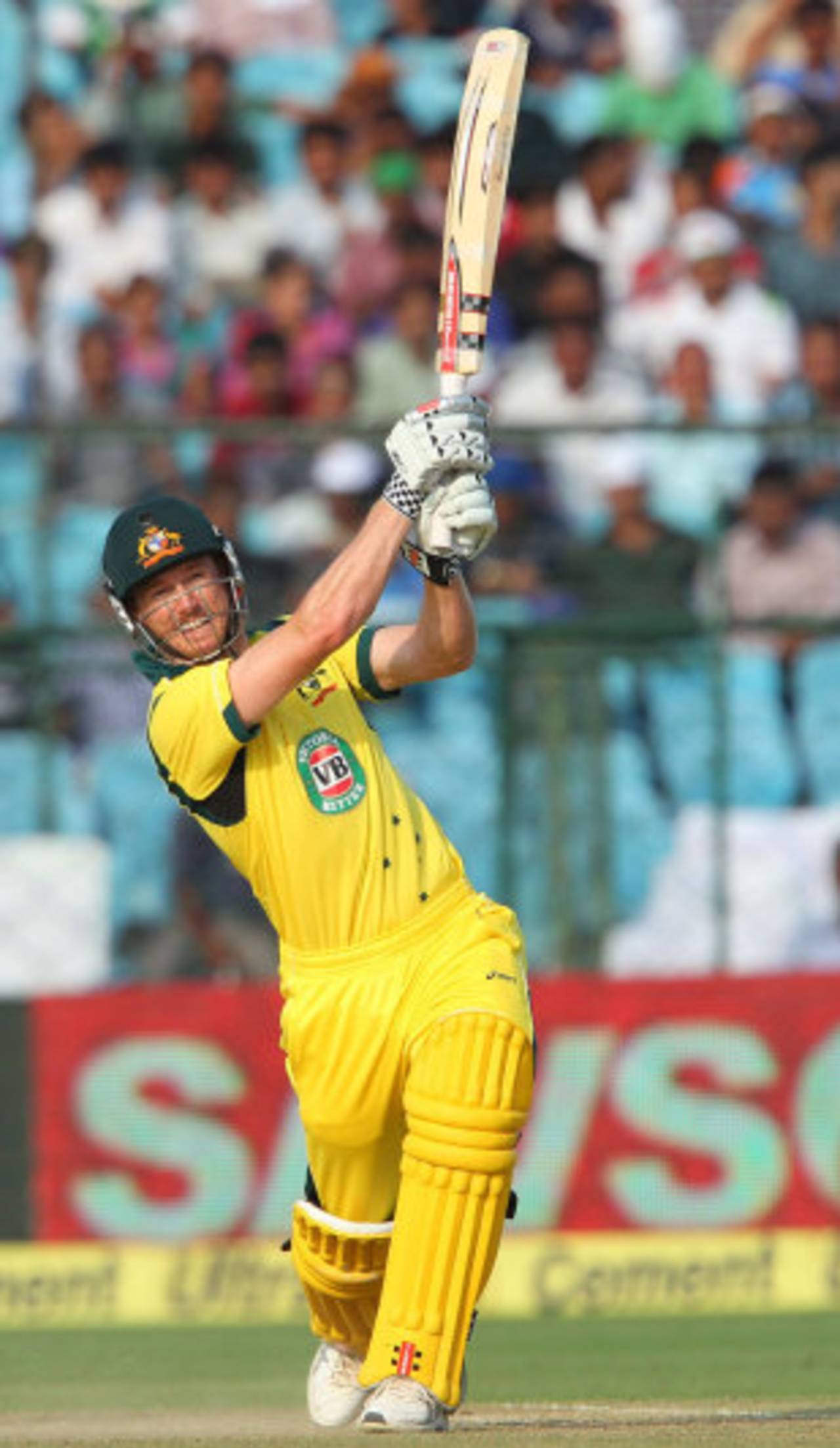 George Bailey plays a lofted shot down the ground, India v Australia, 2nd ODI, Jaipur, October 16, 2013