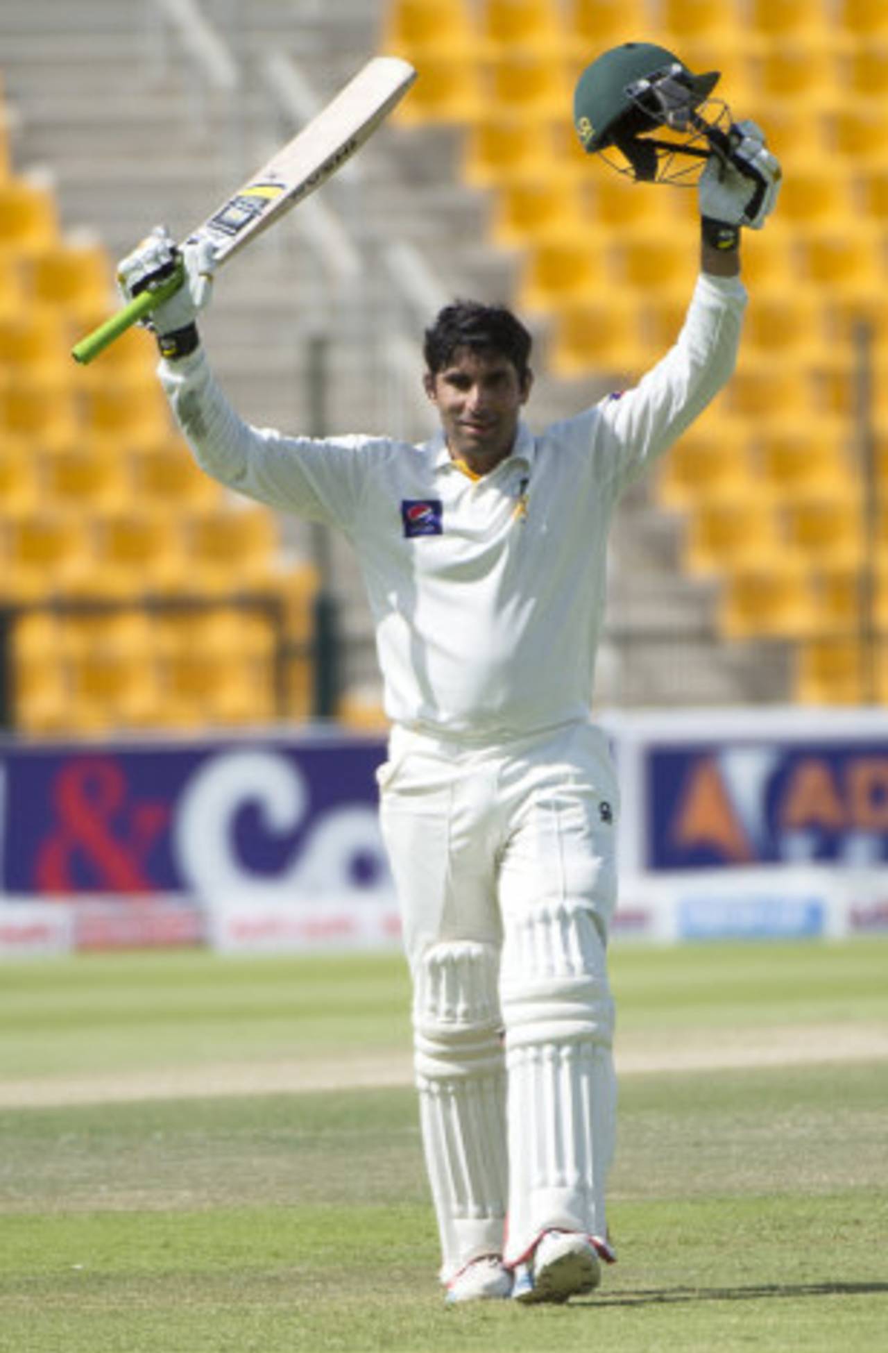 Misbah-ul-Haq raises his arms after reaching a century in Pakistan's first innings.&nbsp;&nbsp;&bull;&nbsp;&nbsp;AFP
