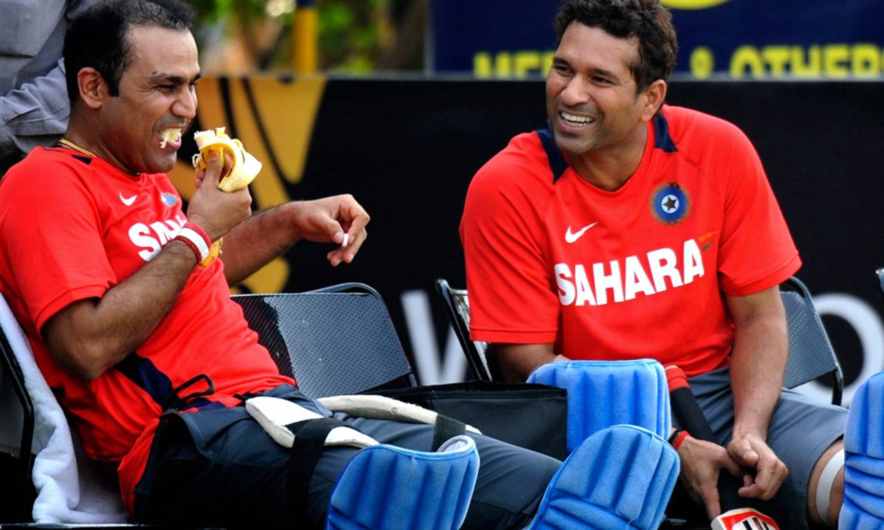 Virender Sehwag struggles to eat a banana while joking with Sachin Tendulkar, Mohali, March 28, 2011