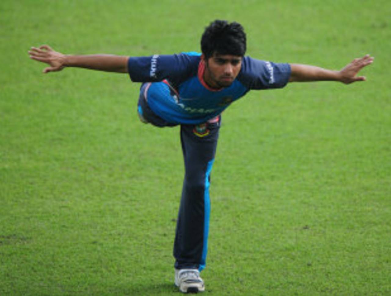 Mominul Haque stretches during a training session, Dhaka, October 28, 2013