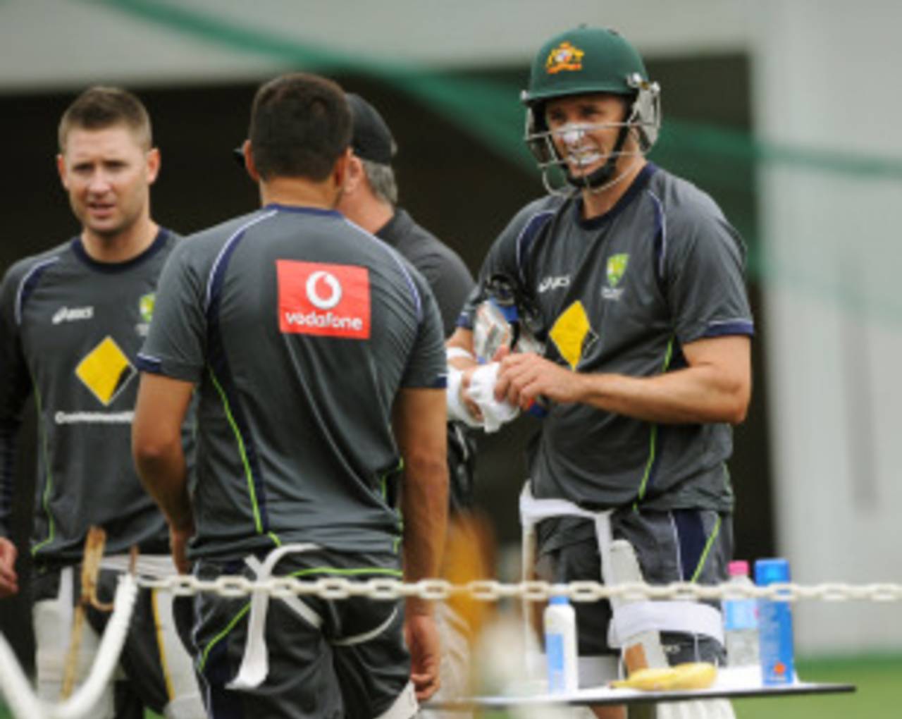 Michael Clarke (left), and Michael Hussey (first from right) speak to team-mates at a training session before the third Test, Australia v Sri Lanka, Sydney, 2 January 2013