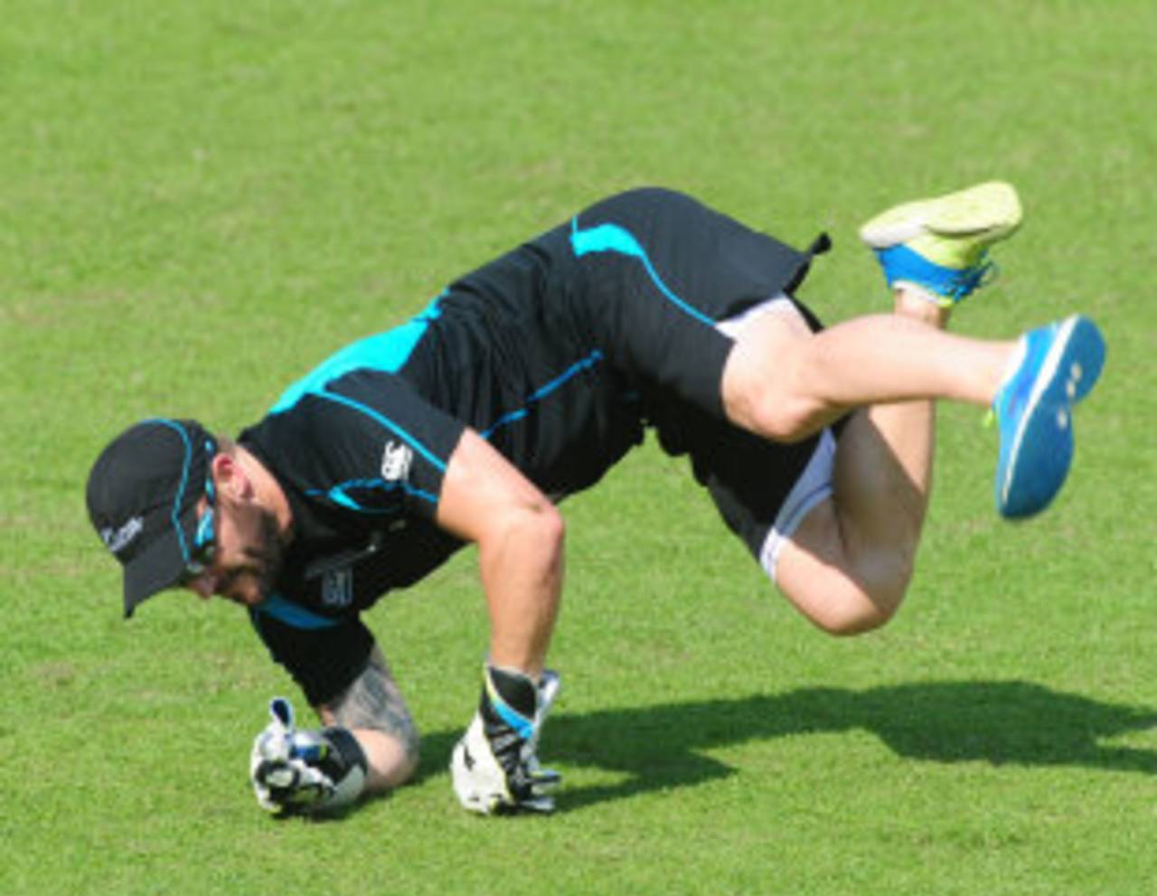 Brendon McCullum dives for a catch during training, Mirpur, October 28, 2013