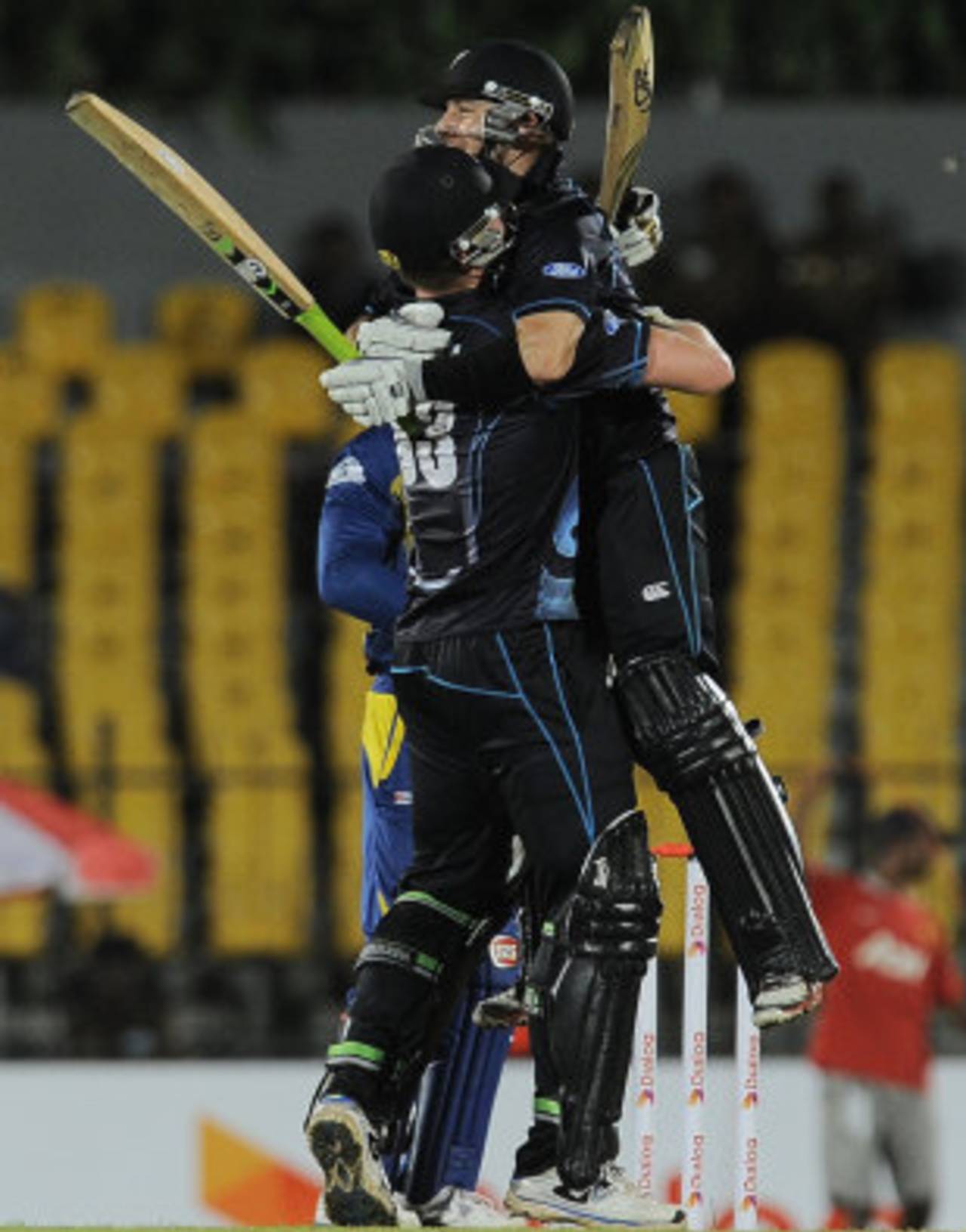 James Neesham and Nathan McCullum embrace after the latter hit the winning run with a six off the final ball, Sri Lanka v New Zealand, 2nd ODI, Hambantota, November 12, 2013