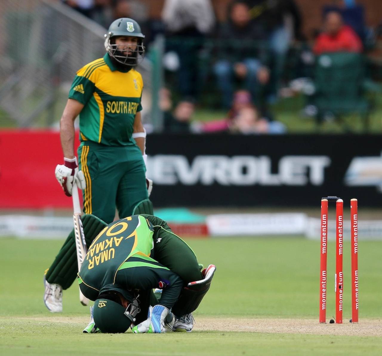 Umar Akmal is in pain after being struck on the knee, South Africa v Pakistan, 2nd ODI, Port Elizabeth, November 27, 2013