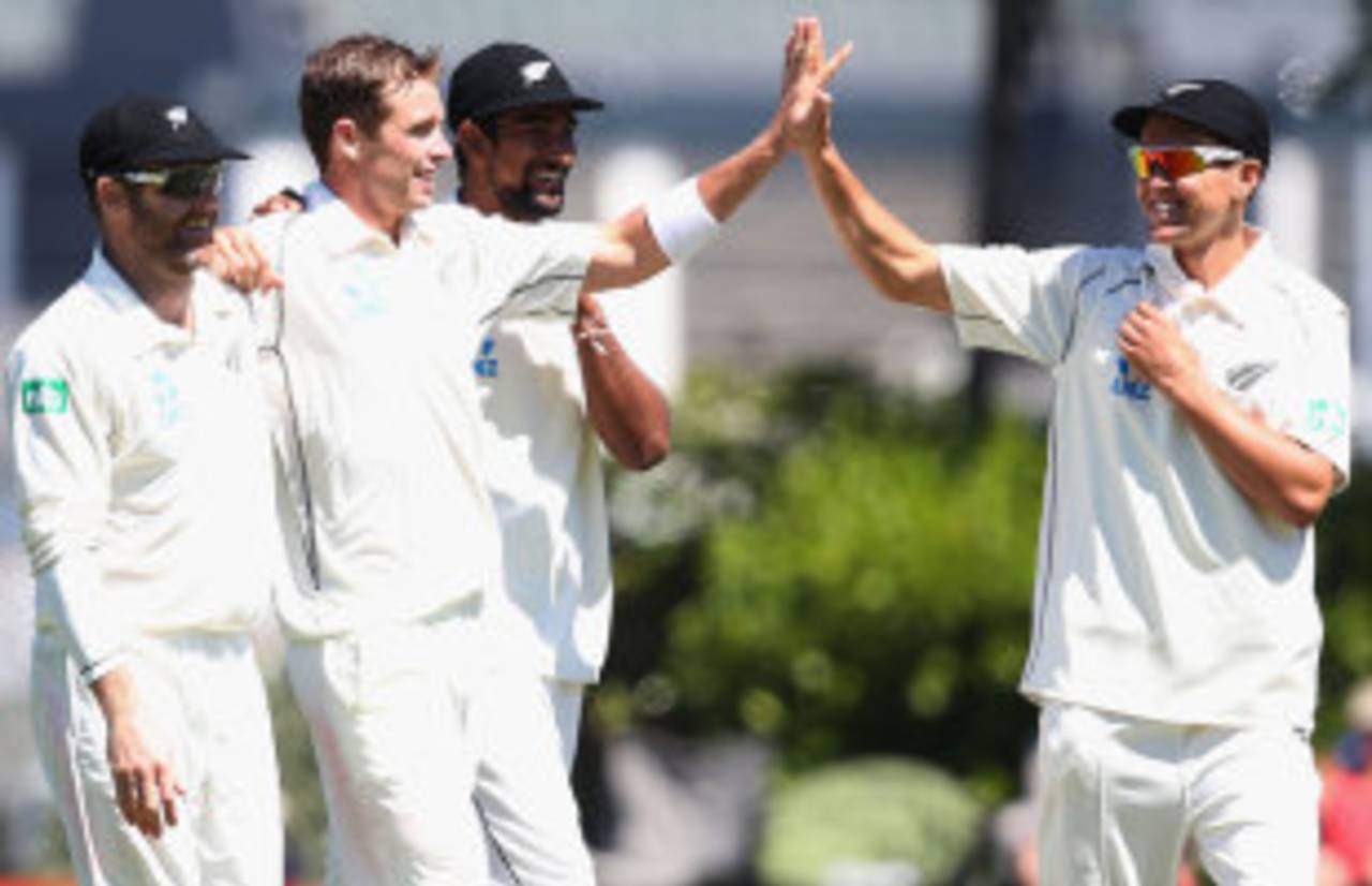 Tim Southee high-fives with Trent Boult, New Zealand v West Indies, 1st Test, Dunedin, 3rd day, December 5, 2013