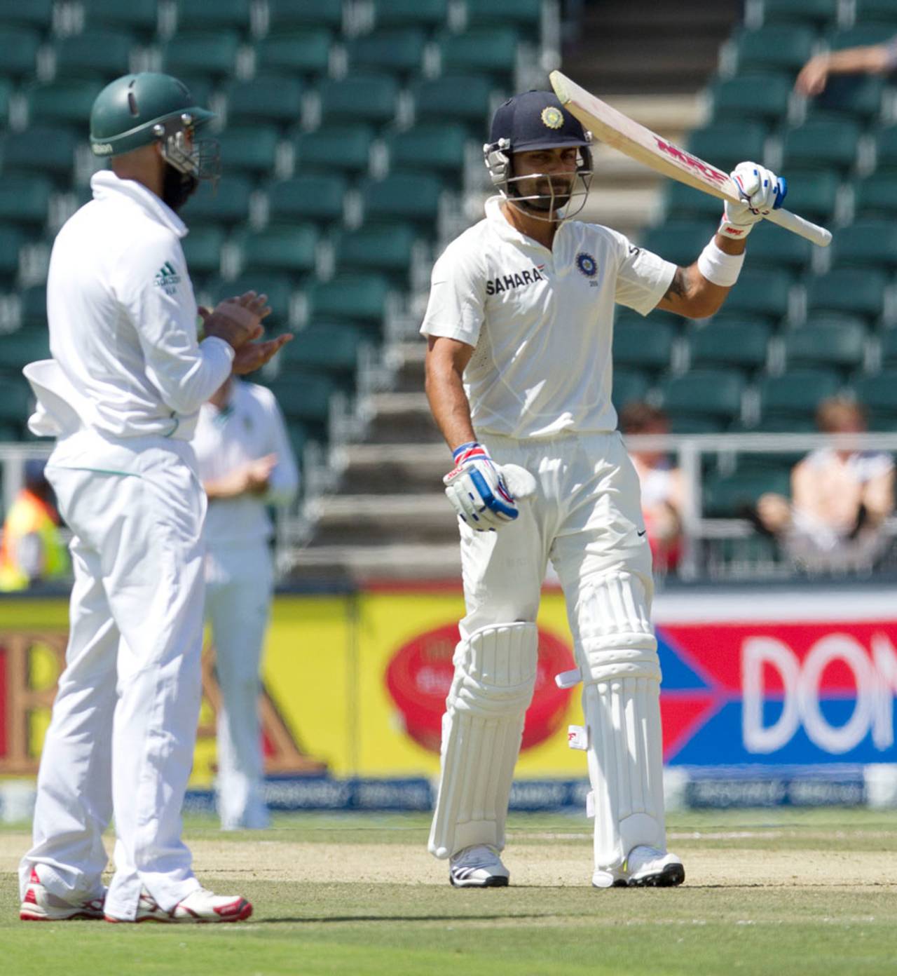 Virat Kohli acknowledges the applause after hitting a maiden Test fifty in South Africa, South Africa v India, 1st Test, Johannesburg, 1st day, December 18, 2013
