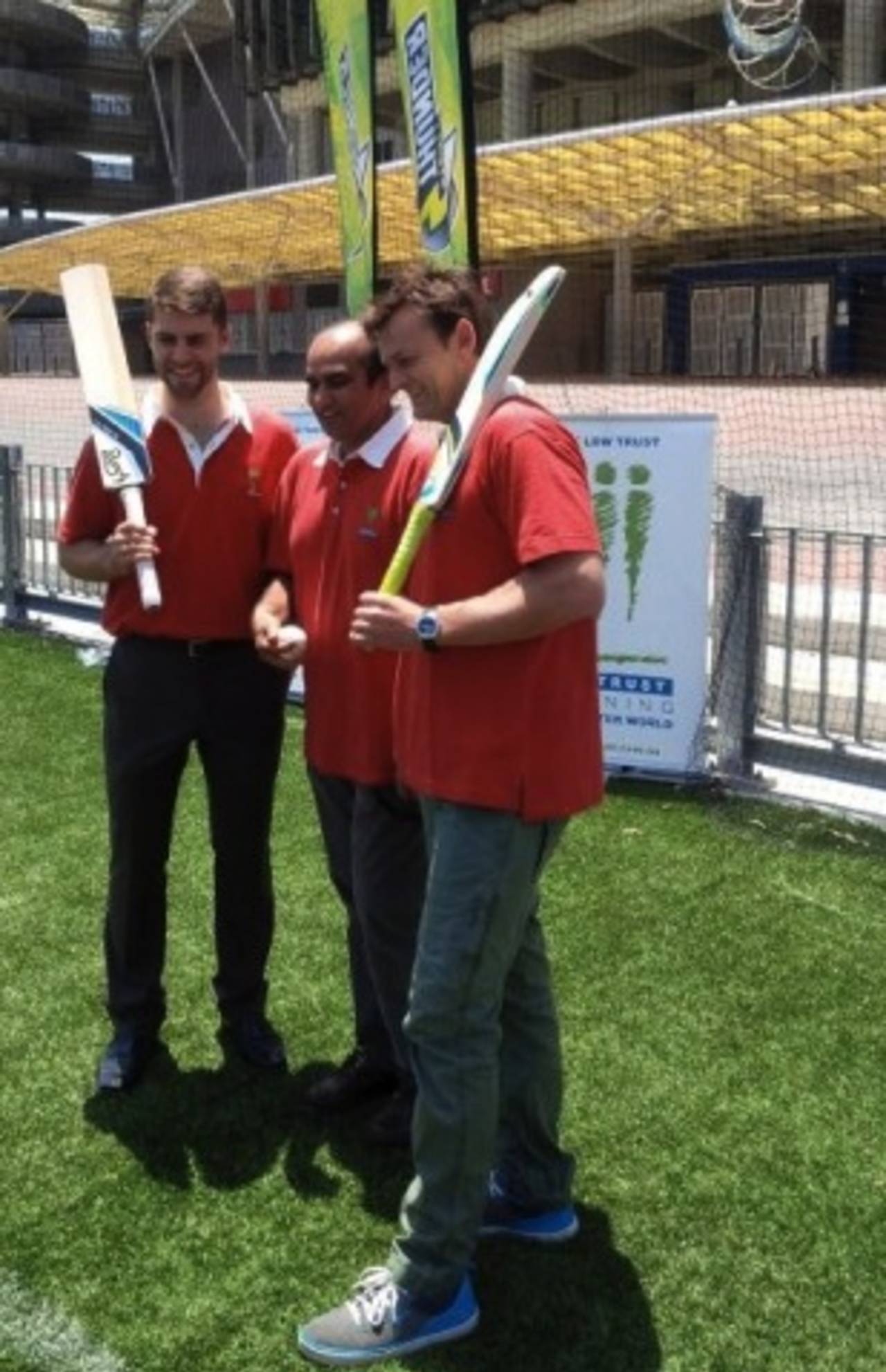 Sydney Thunder wicketkeeper Ryan Carters, LBW Trust chairman Darshak Mehta and former Test gloveman Adam Gilchrist at the launch of Batting for Change, Sydney, December 21