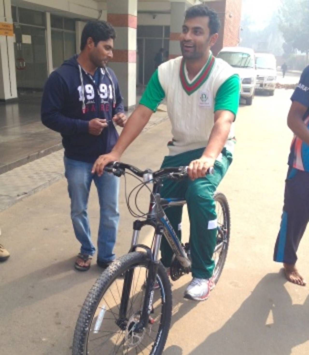 Tamim Iqbal takes a bike ride outside the Sher-e-Bangla stadium, Dhaka, January 22, 2014