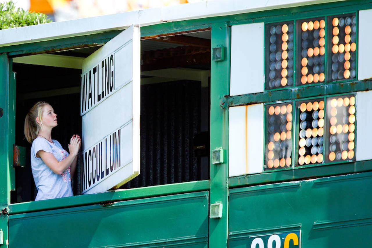 A scoreboard attendant at the fall of BJ Watling's dismissal, New Zealand v India, 2nd Test, 4th day, Wellington, February 17, 2014