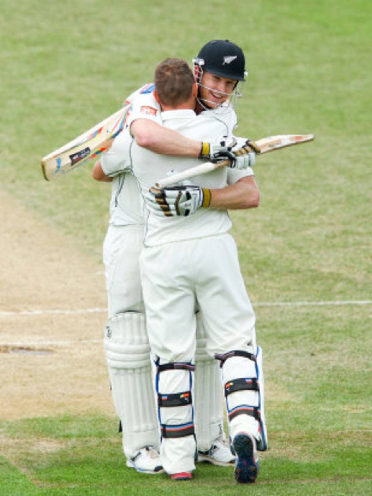 Brendon McCullum and Jimmy Neesham fall into an embrace, New Zealand v India, 2nd Test, Wellington, 5th day, February 18, 2014