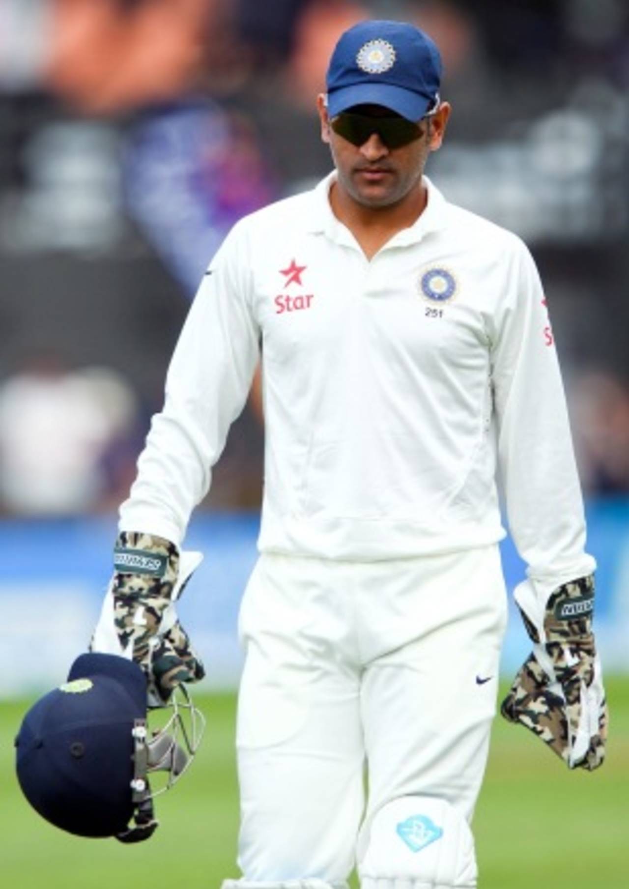 MS Dhoni walks back for the lunch break, New Zealand v India, 2nd Test, Wellington, February 14, 2014