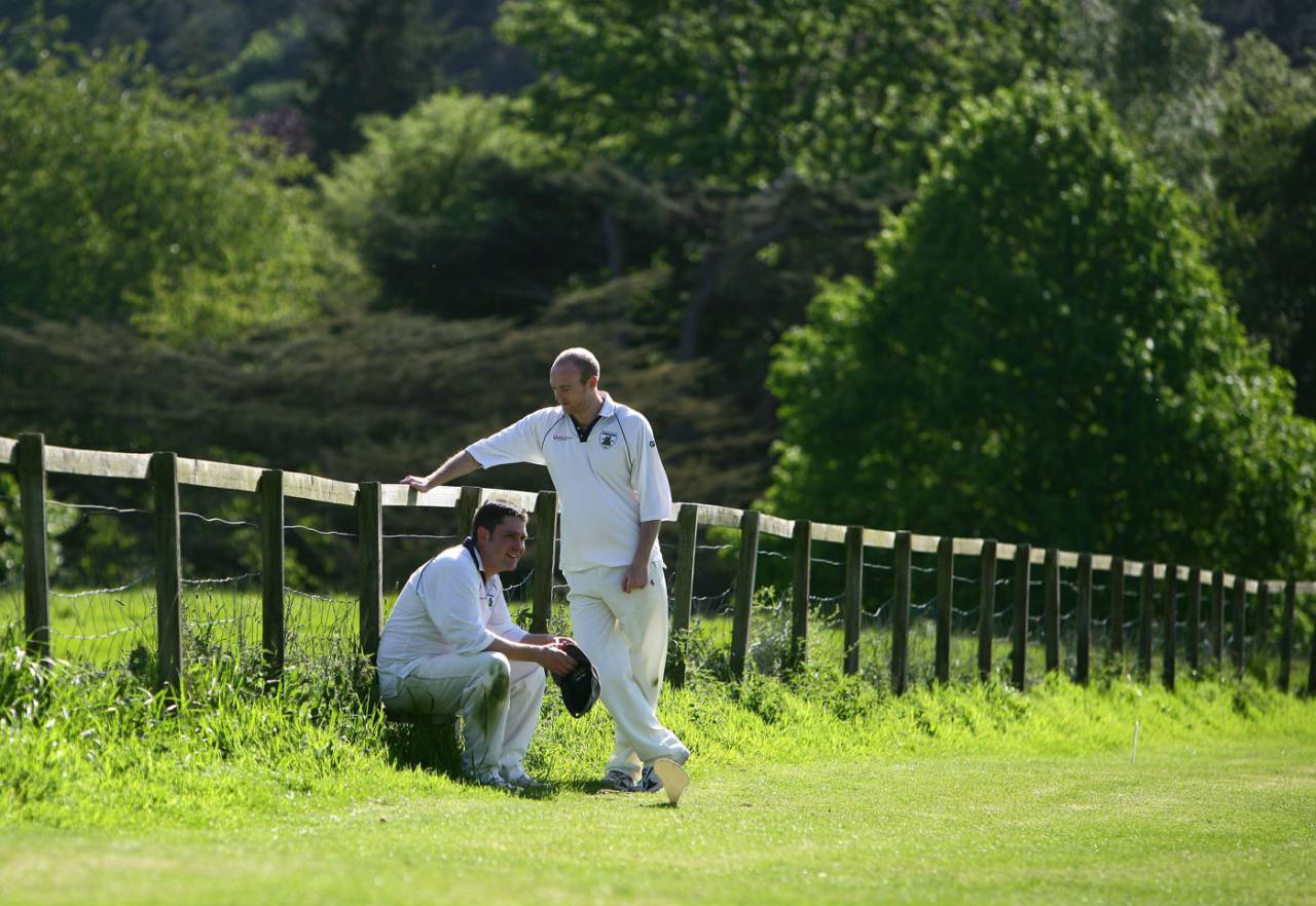  Fielders rest on the boundary's edge at Hawarden Park Cricket Club at the foot of Hawarden Castle in Wales, May 19, 2007