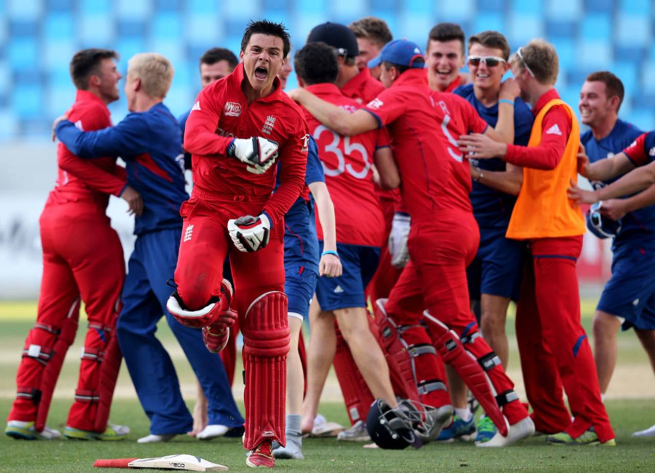 Rob Jones and a jubilant England team celebrate their win, India v England, Under-19 World Cup 2014, quarter-final, Dubai, February 22, 2014