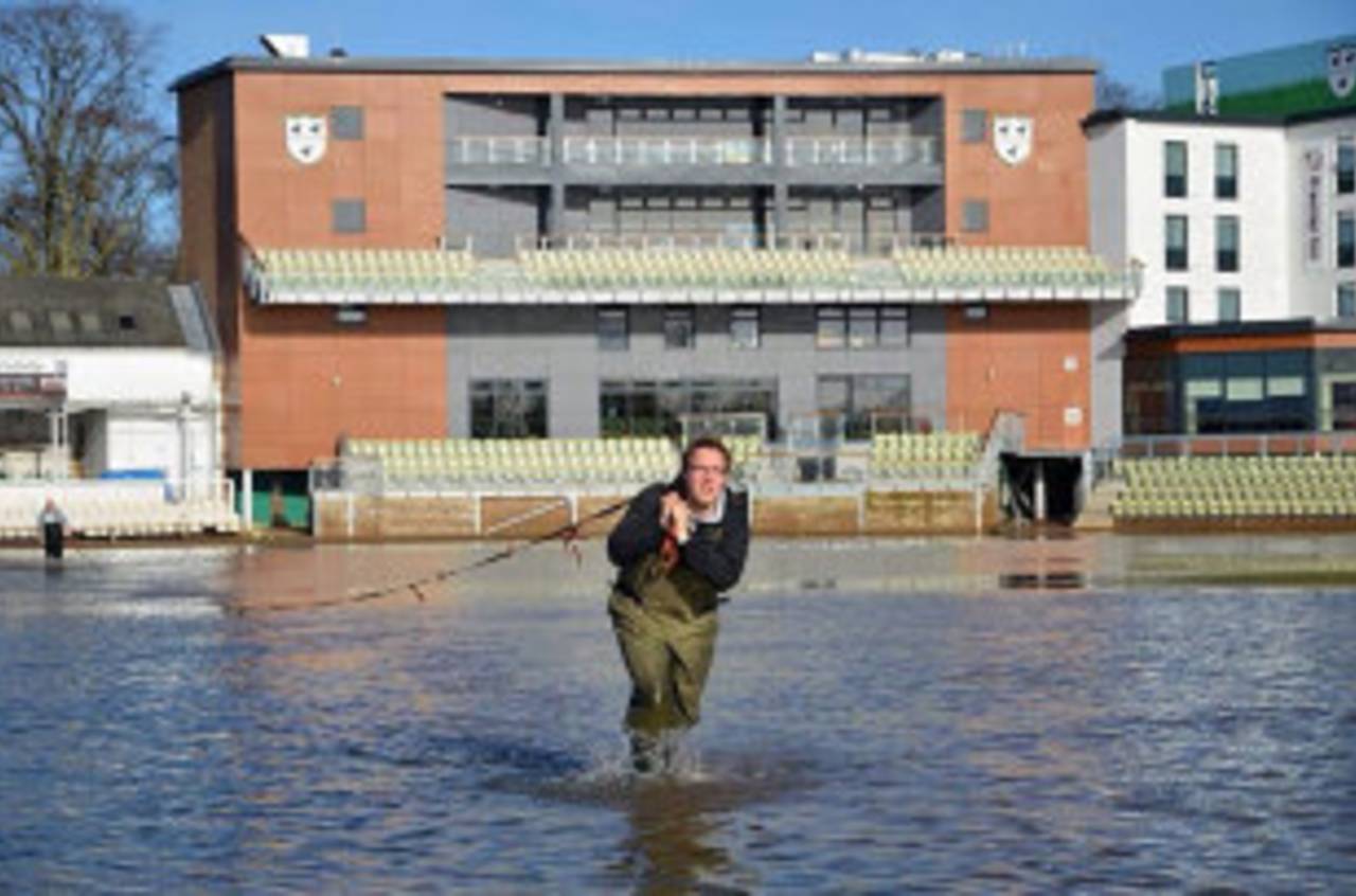 Worcestershire's groundstaff wade through the floods earlier this year&nbsp;&nbsp;&bull;&nbsp;&nbsp;Worcestershire CCC