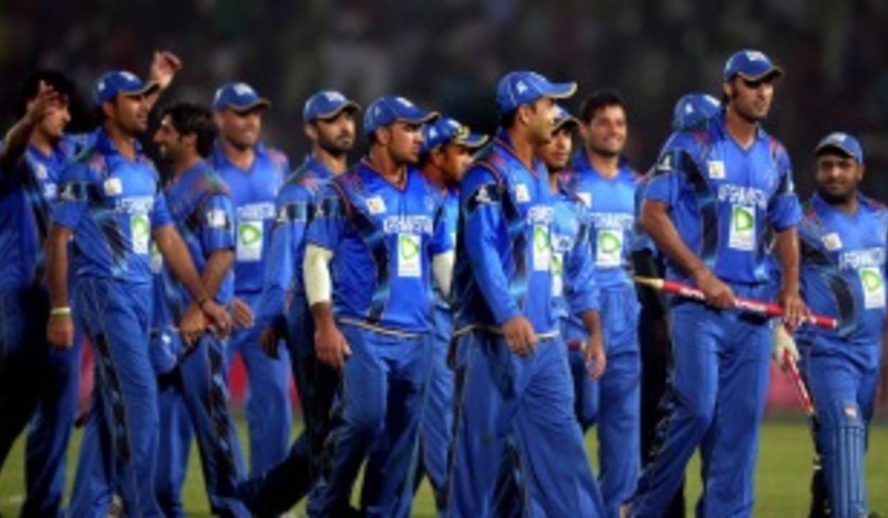 A victorious Afghanistan team walks back, Bangladesh v Afghanistan, Asia Cup, Fatullah, March 1, 2014