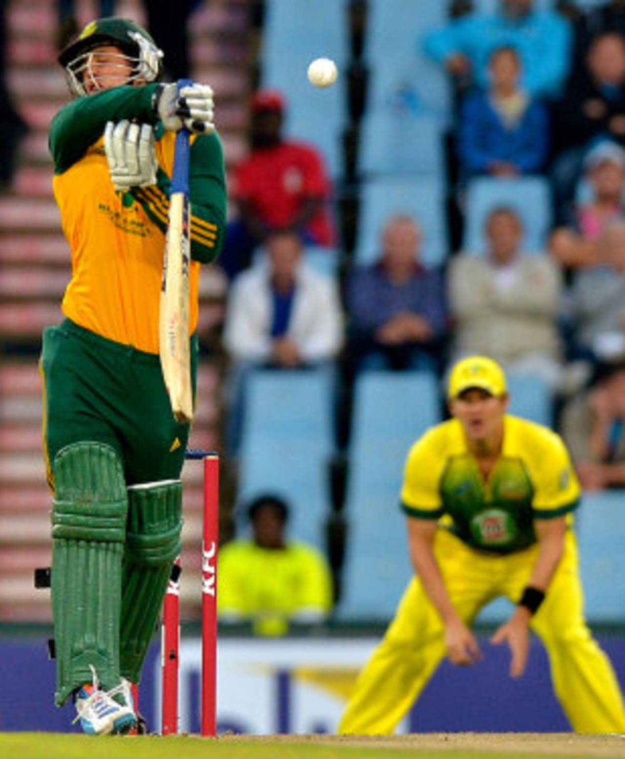 Quinton de Kock takes a blow on the helmet from the 'other Mitchell' - Starc, South Africa v Australia, 3rd T20, Centurion, March 14, 2014
