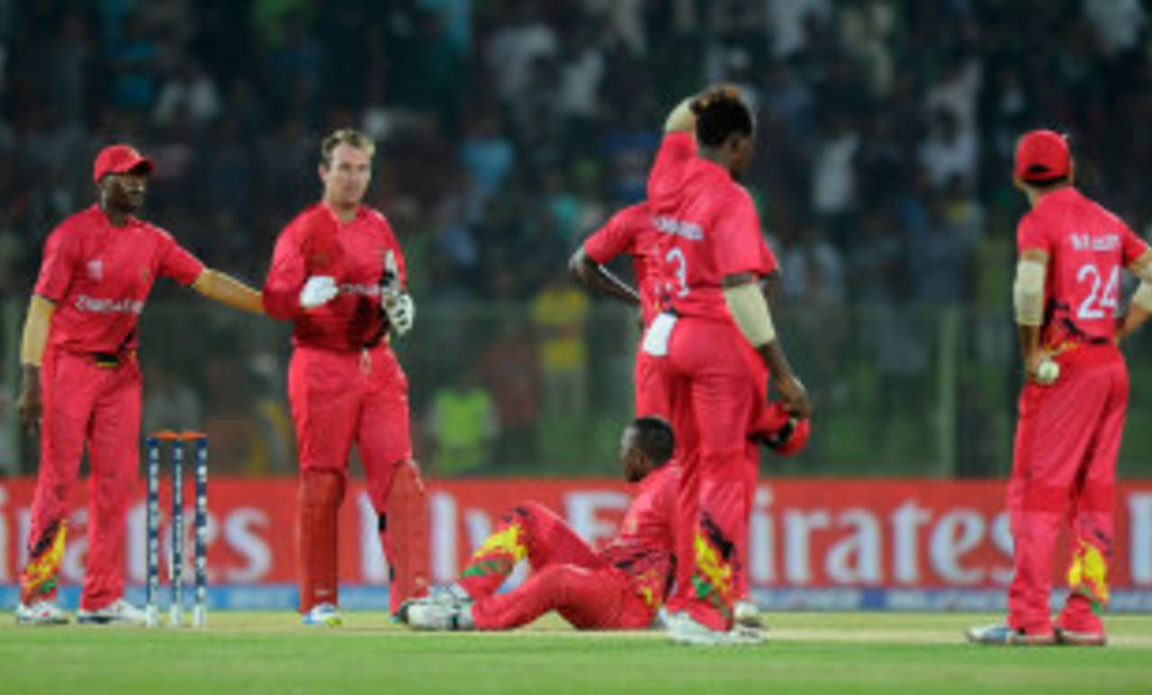 Zimbabwe's players react after Ireland win the match with a stolen bye off the last ball, Ireland v Zimbabwe, World T20, First Round Group B, March 17, 2014