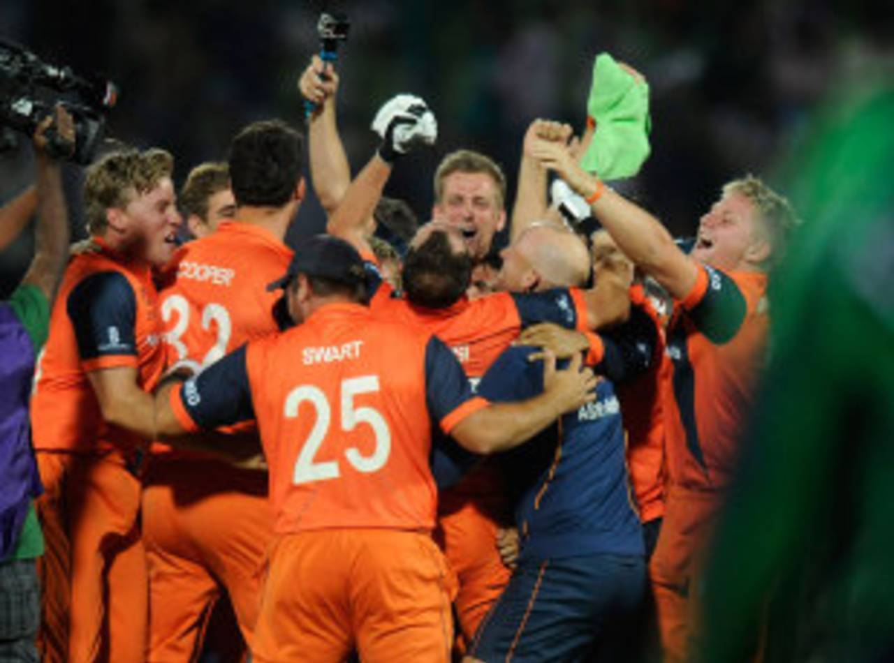 Netherlands' players celebrate after qualifying for the Super 10 stage, Ireland v Netherlands, World T20, First Round Group B, Sylhet, March 21, 2014