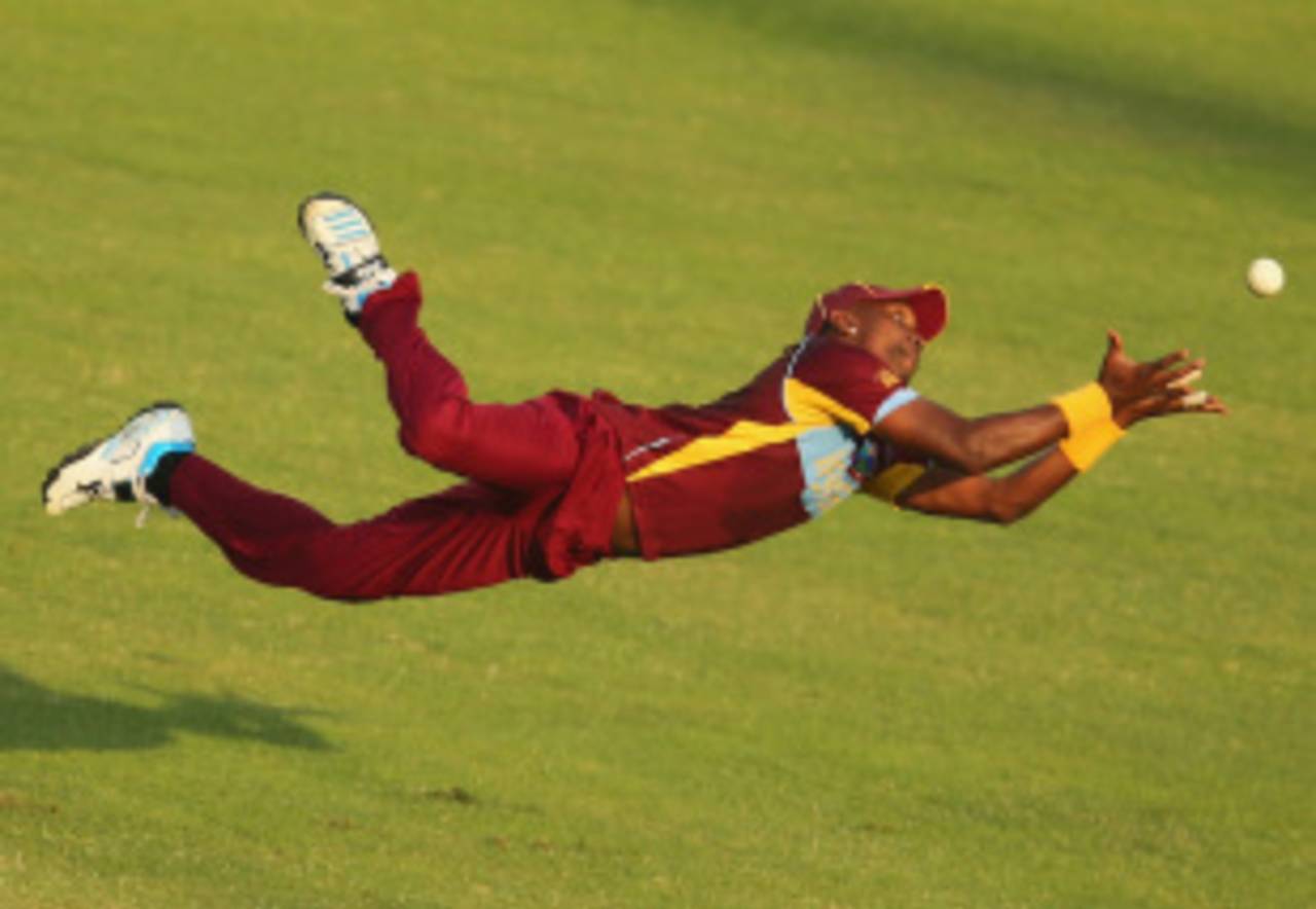 Dwayne Bravo has his eyes firmly on the ball as he goes for the catch, Australia v West Indies, World T20, Group 2, Mirpur, March 28, 2014
