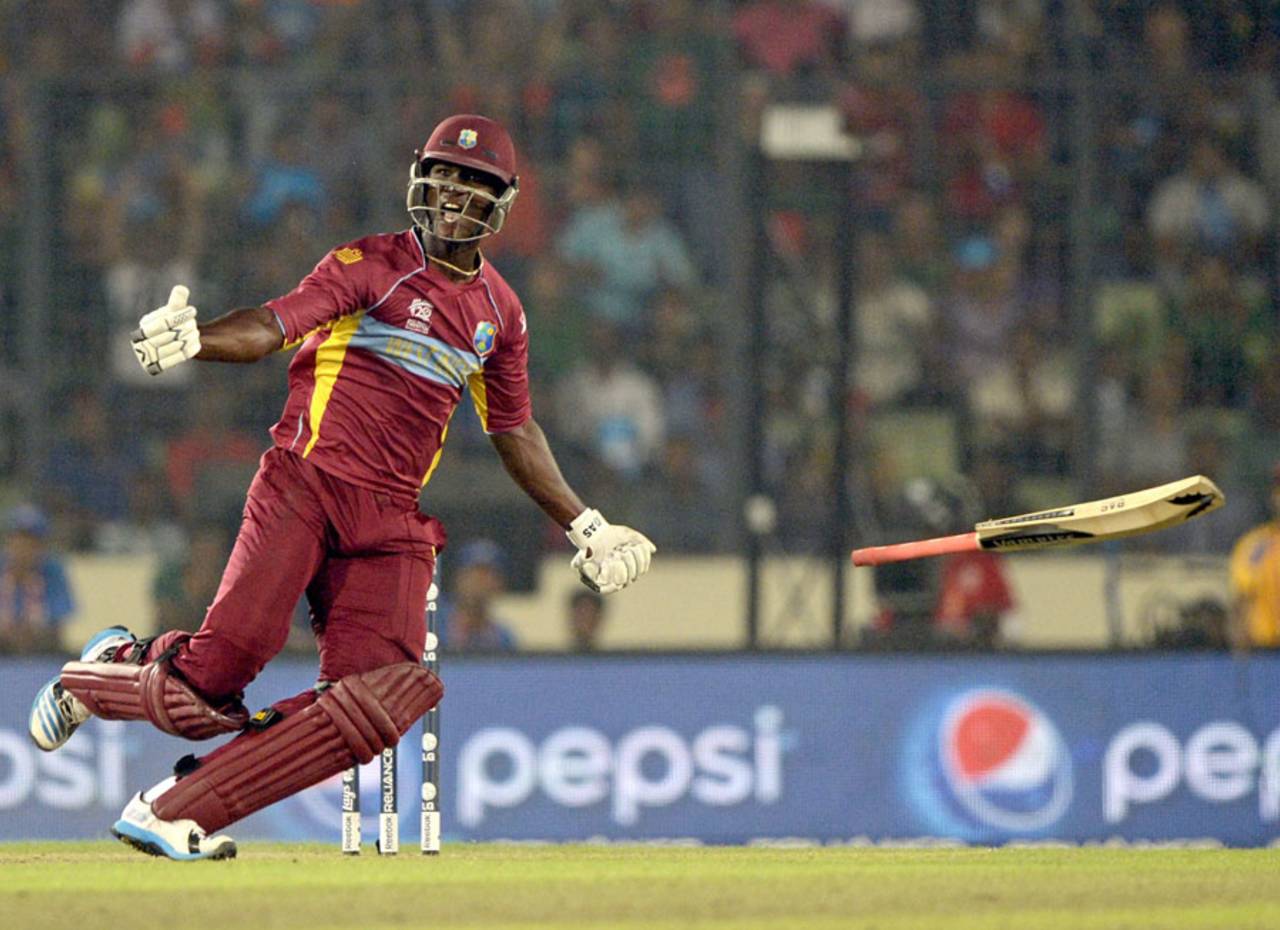 Darren Sammy celebrates the win by tossing his bat in the air, Australia v West Indies, World T20, Group 2, Mirpur, March 28, 2014
