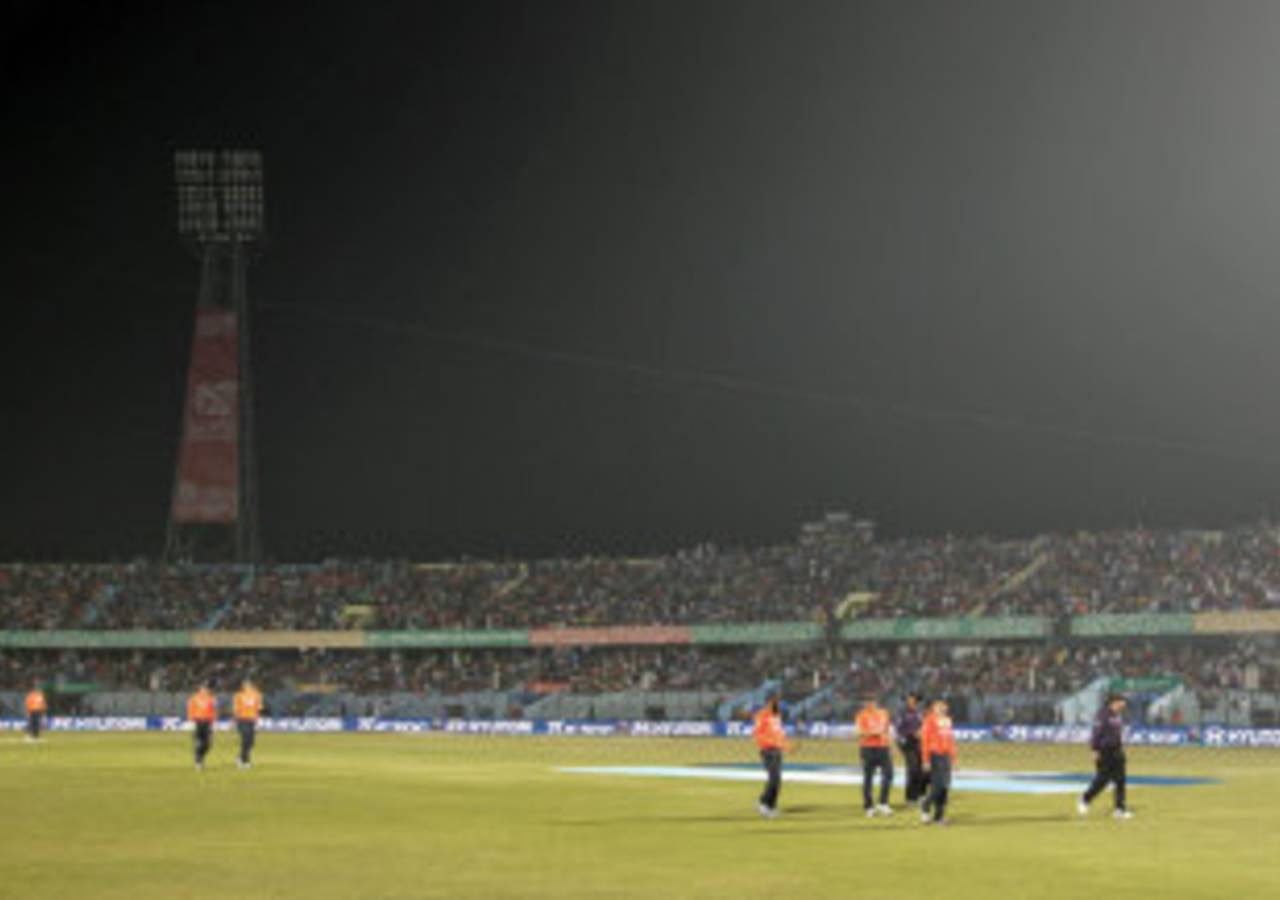 Players walk off the field after one of the light towers suffers an outage, England v South Africa, World Twenty20 2014, Group 1, Chittagong, March 29, 2014