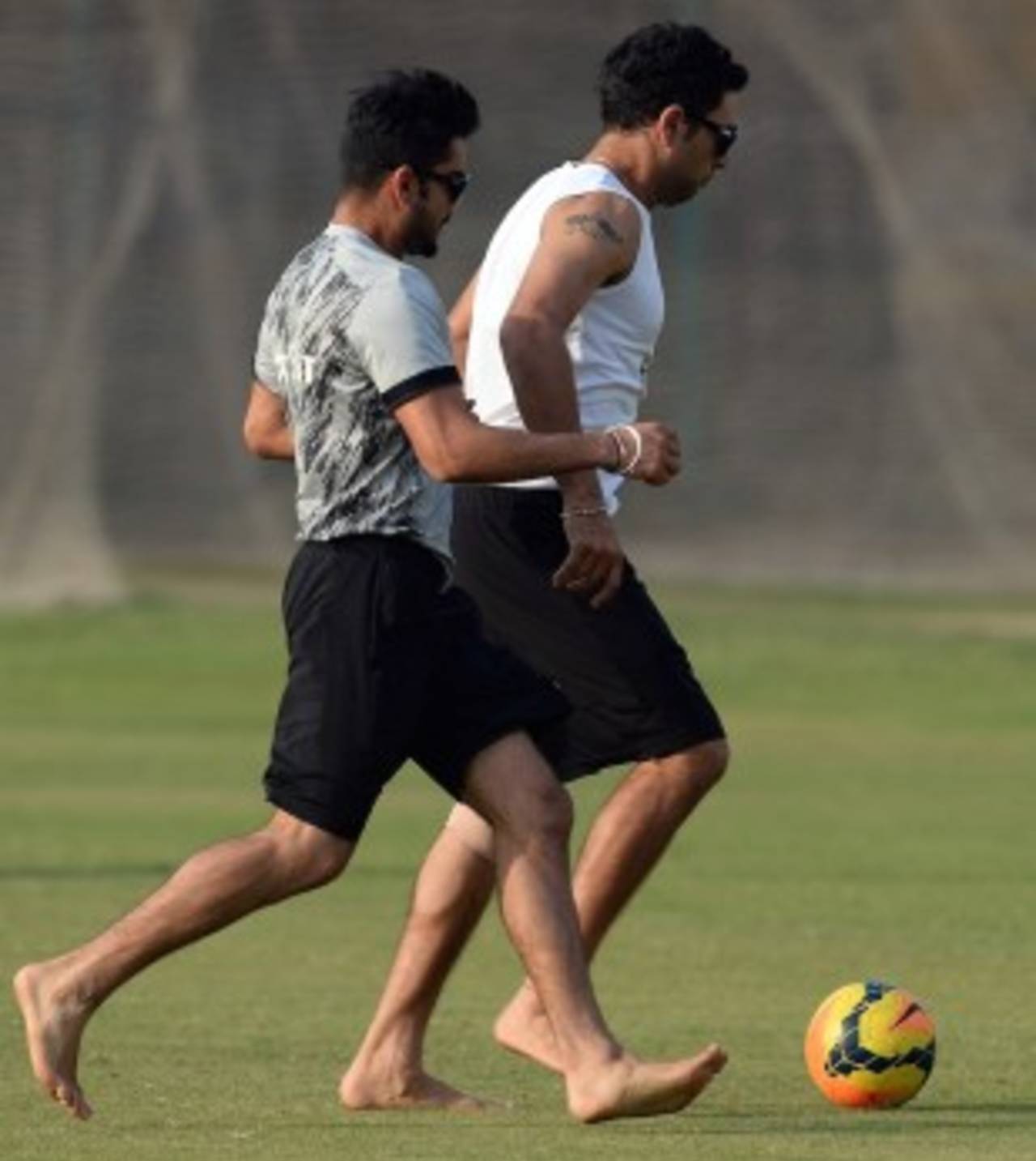 Happy feet: Virat Kohli and Yuvraj Singh during their football training, Dhaka, April 1, 2014