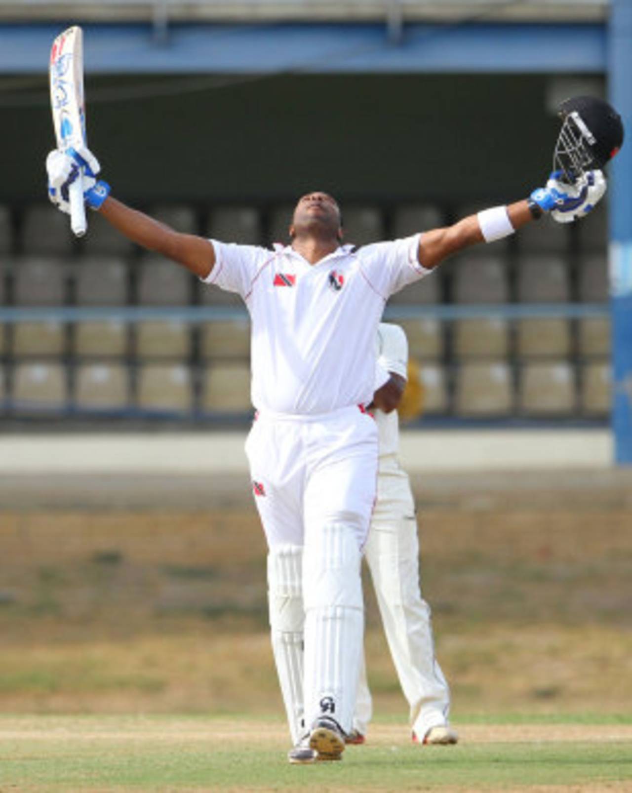 Kieron Pollard celebrates a ton in this second match back from injury, Trinidad & Tobago v Jamaica, Regional Four Day Competition, Port of Spain, April 4, 2014, Day 1