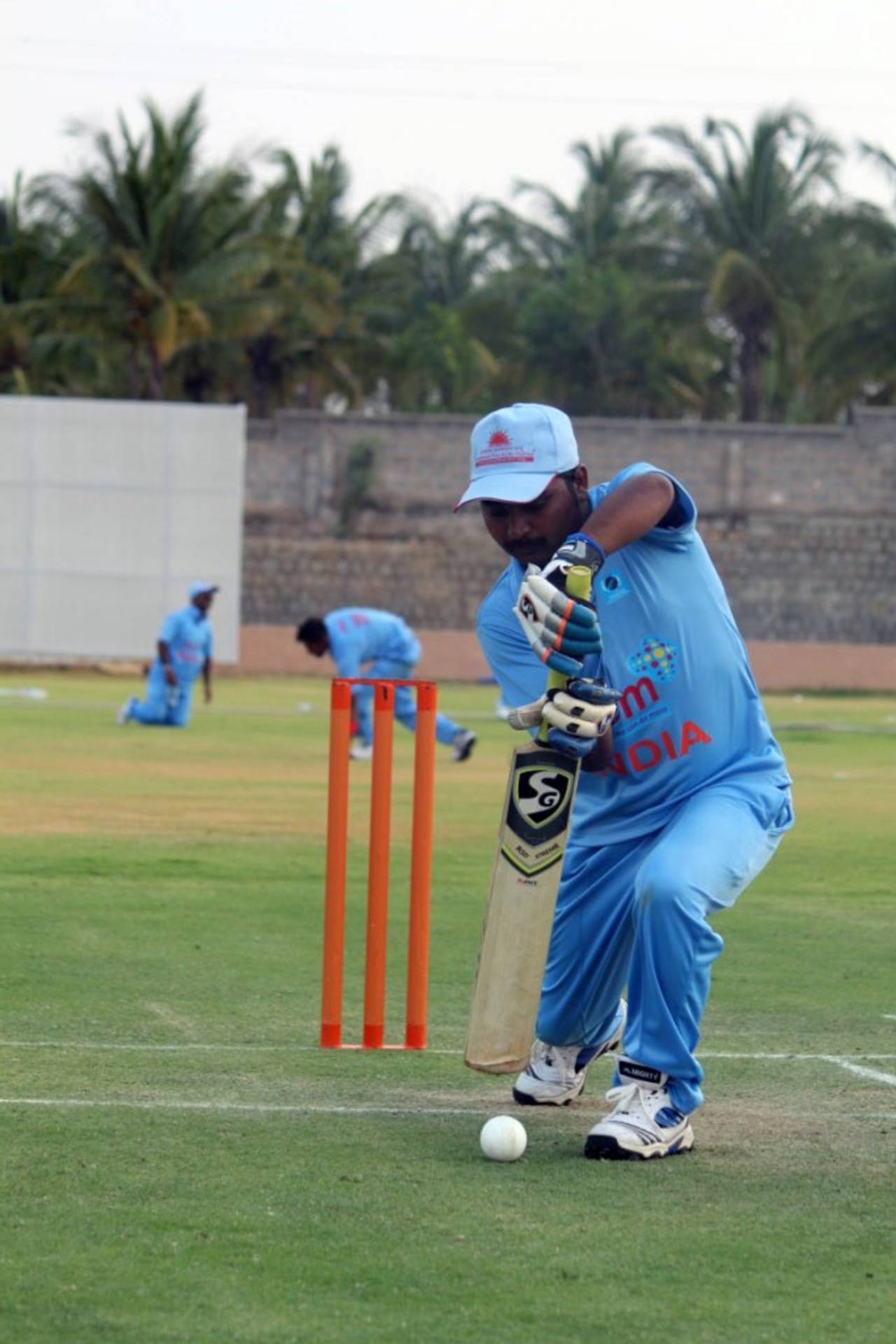 Shekhar Naik, India's visually-impaired cricket captain, defends a ball, Bangalore, April 12, 2014