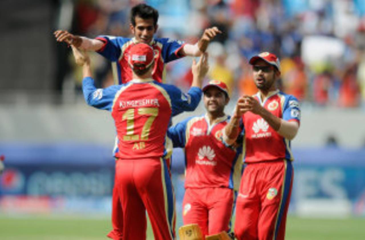 Yuzvendra Chahal is congratulated after a wicket, Royal Challengers Bangalore v Mumbai Indians, Indian Premier League, Dubai, April 19, 2014