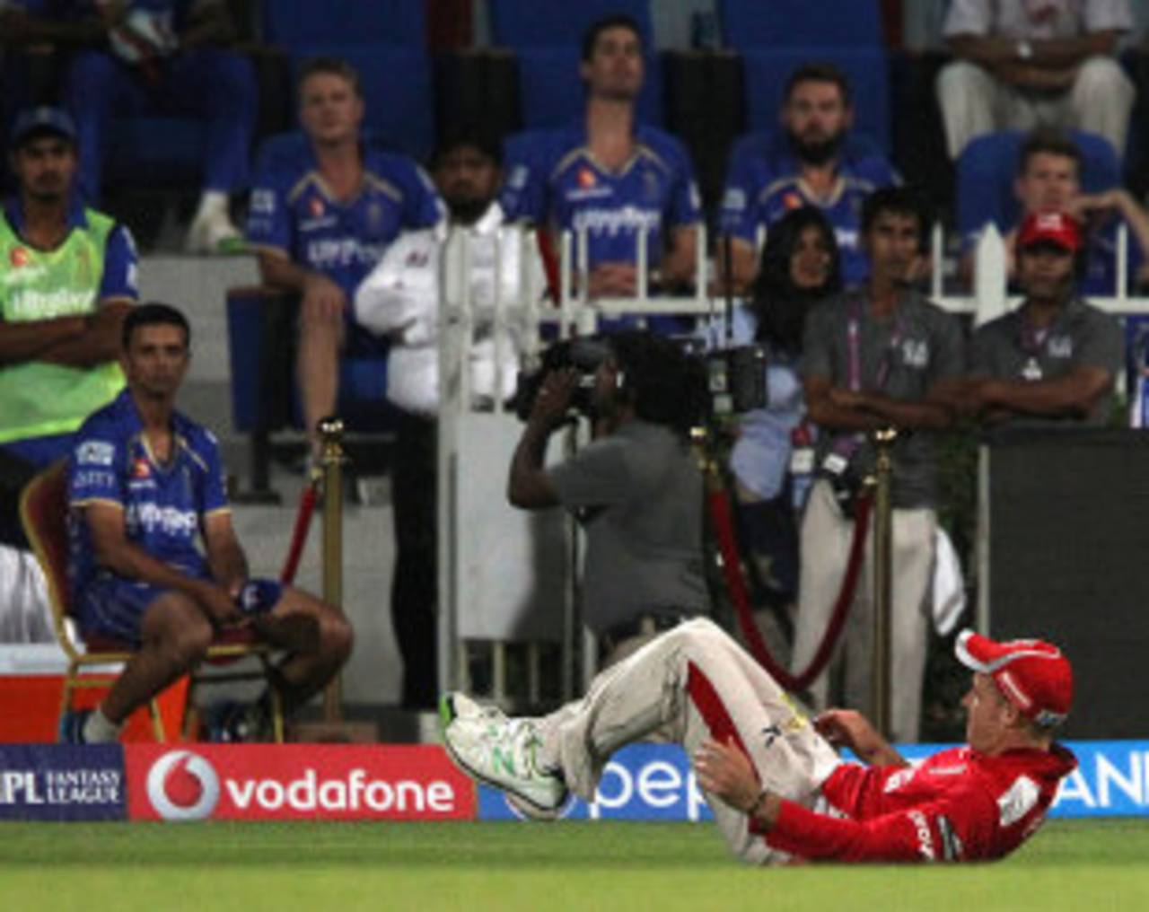 The ball is wedged between David Miller's legs after the ball slipped through his fingers, Rajasthan Royals v Kings XI Punjab, IPL 2014, Sharjah, April 20, 2014